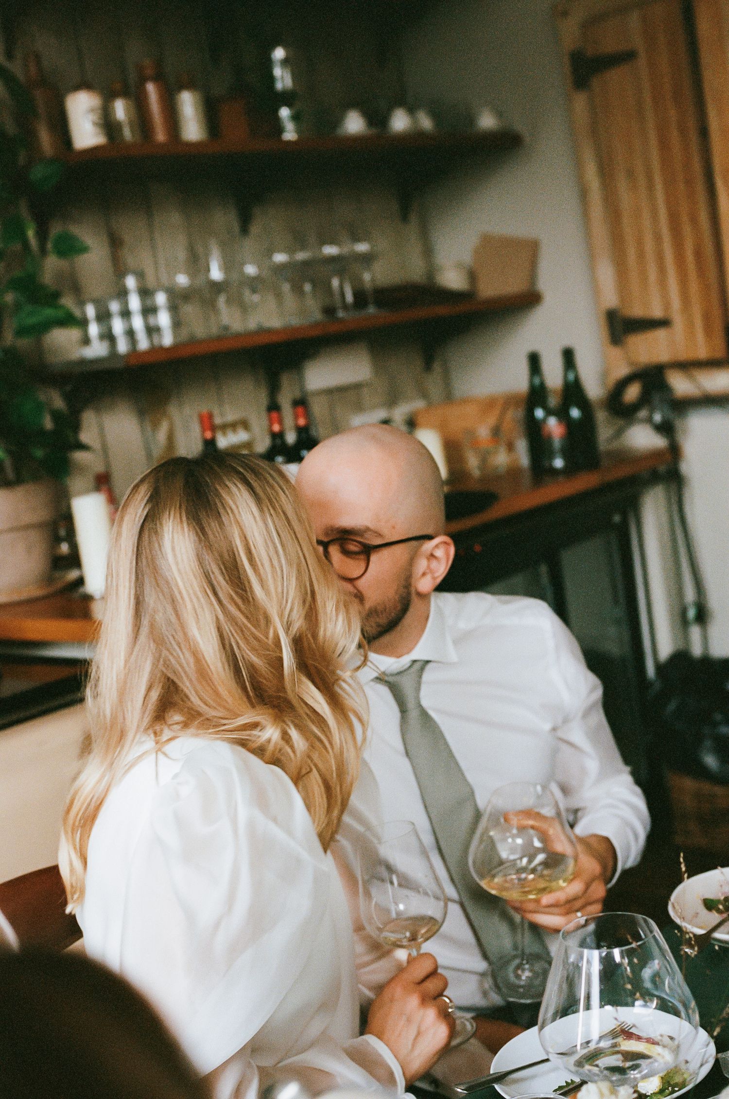 Wine tasting experience in a rustic restaurant interior.