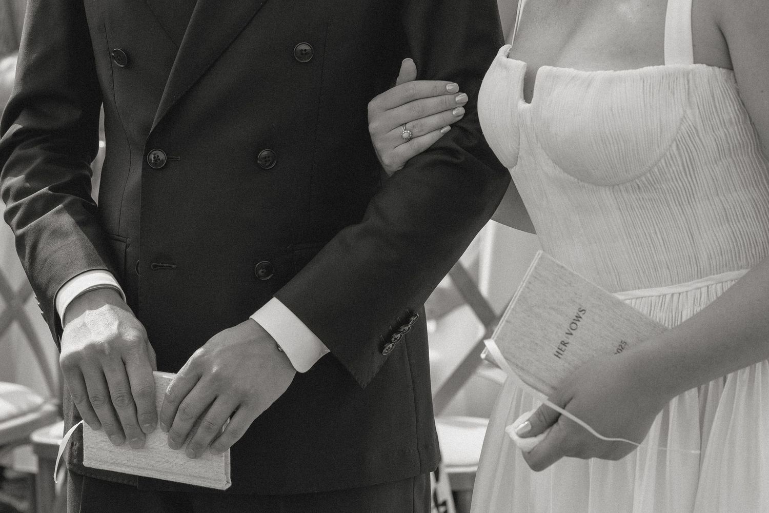 Close-up details of formal wedding attire in black and white.