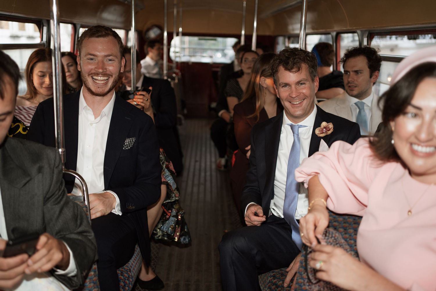 Celebratory gathering with guests in formal attire enjoying festivities.