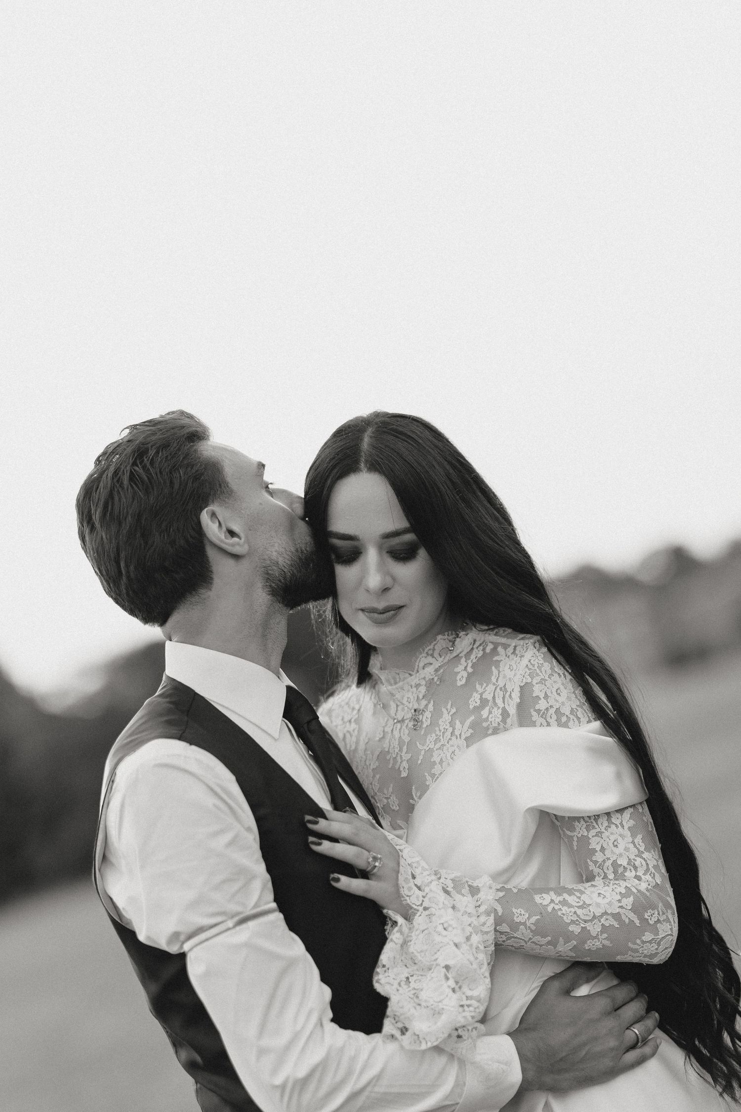 A series of romantic black and white portraits showing tender moments between newlyweds.