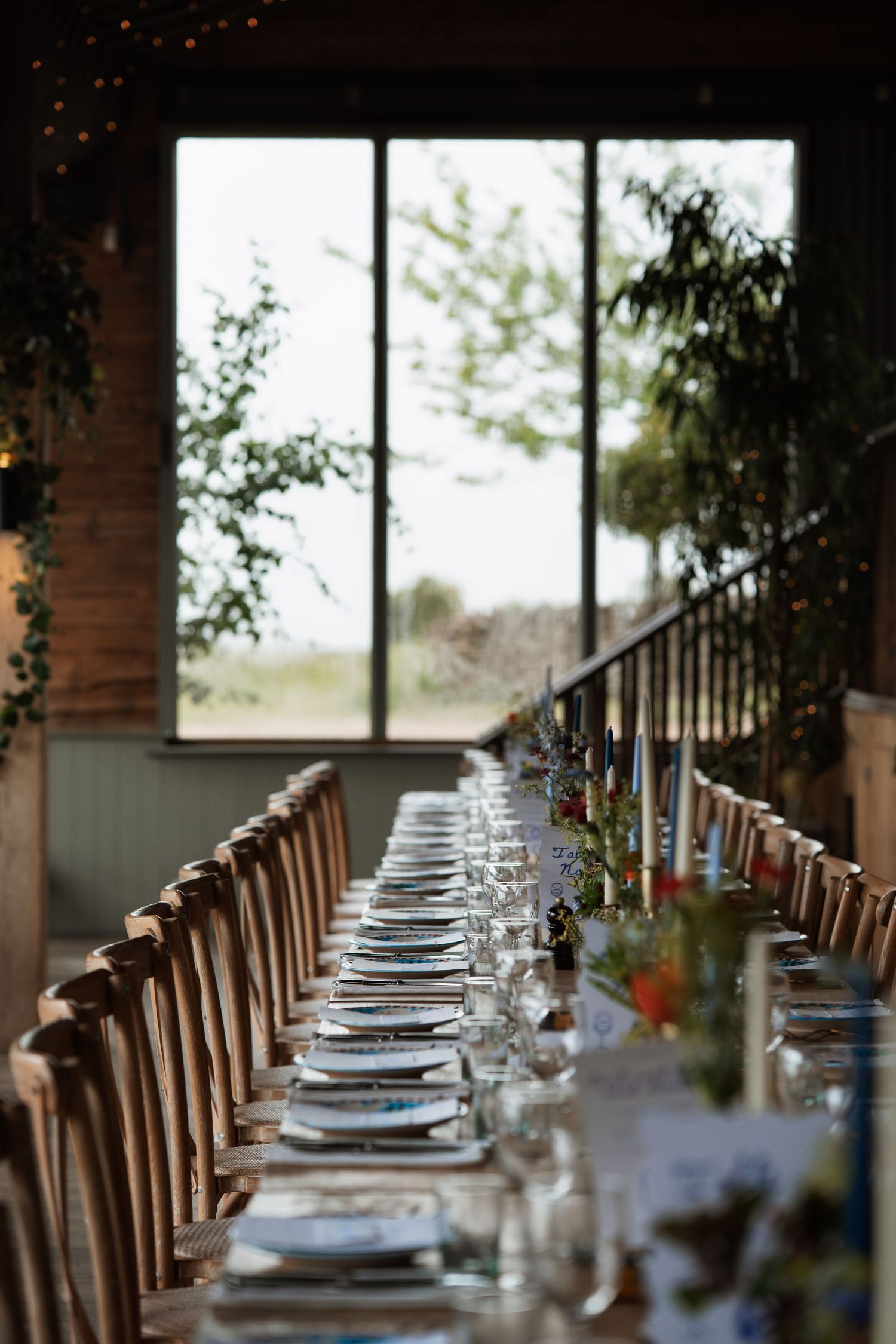 Formal table settings with glassware and place settings arranged for an elegant dinner event.