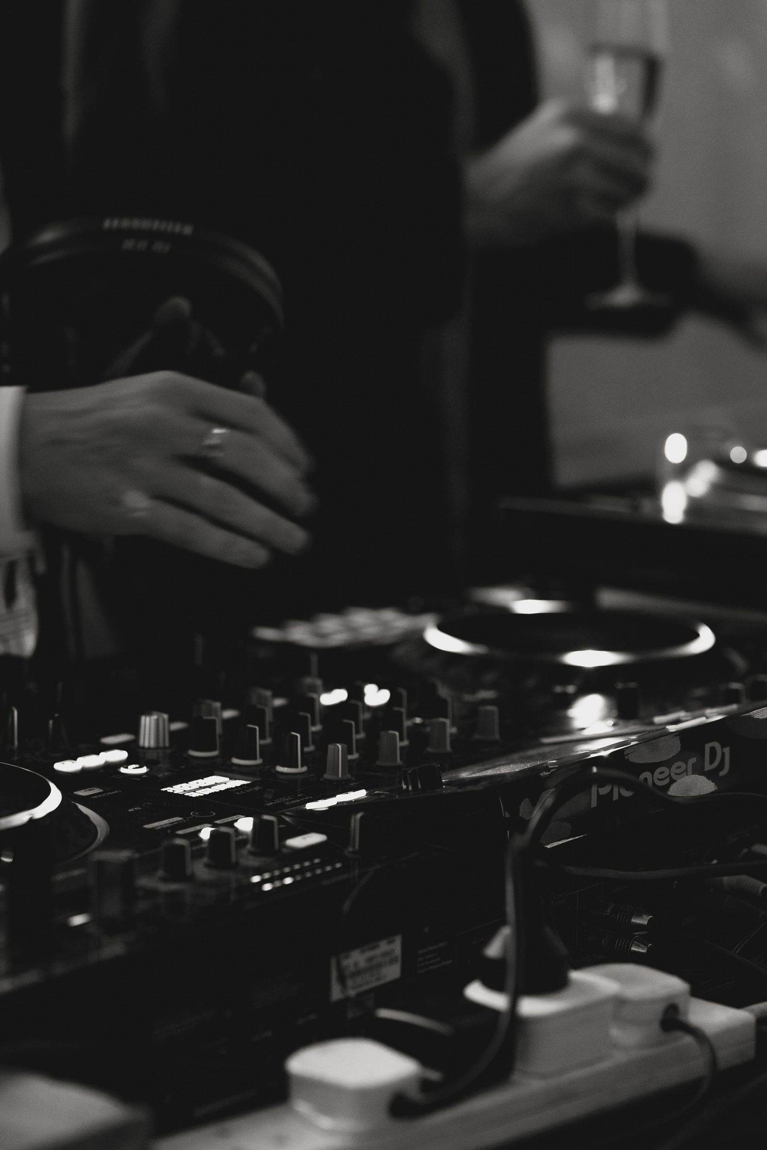 Close-up of DJ equipment and turntables at a wedding reception.