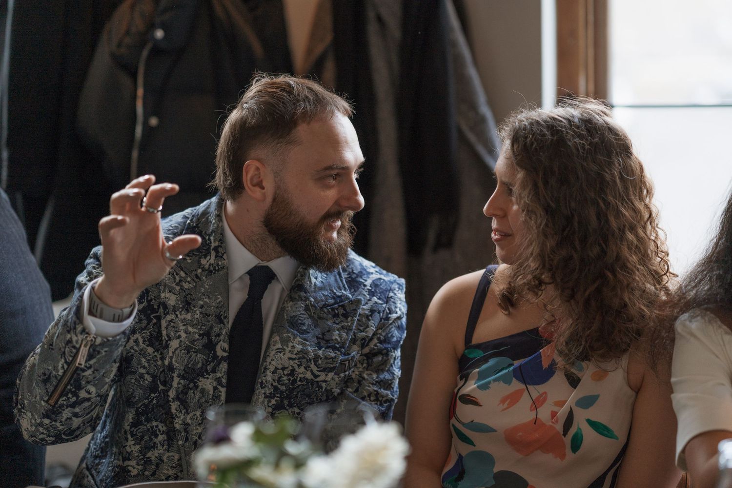 Candid moments of wedding guests laughing and socializing at a celebration.