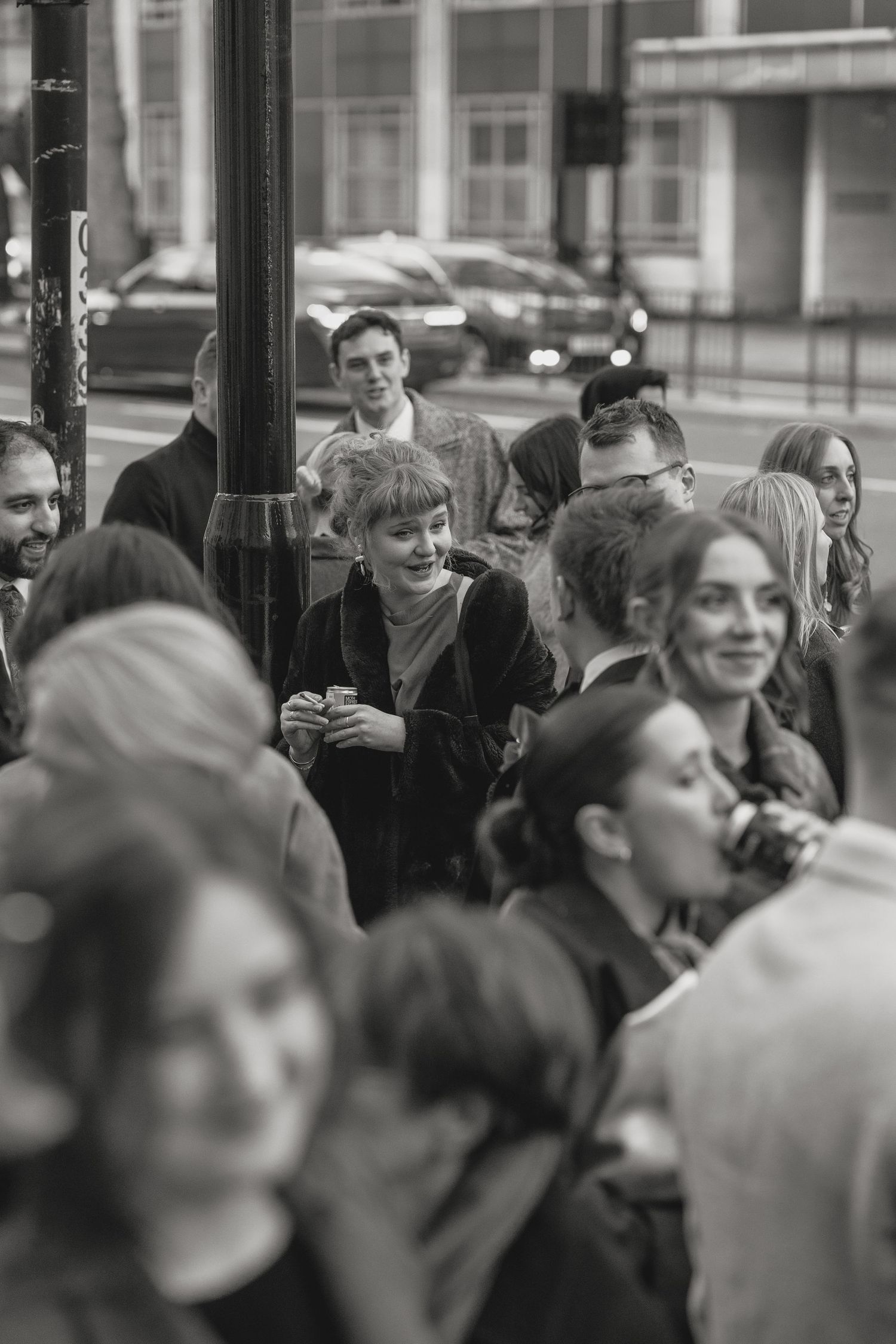 A crowded gathering of people shown in black and white photography.