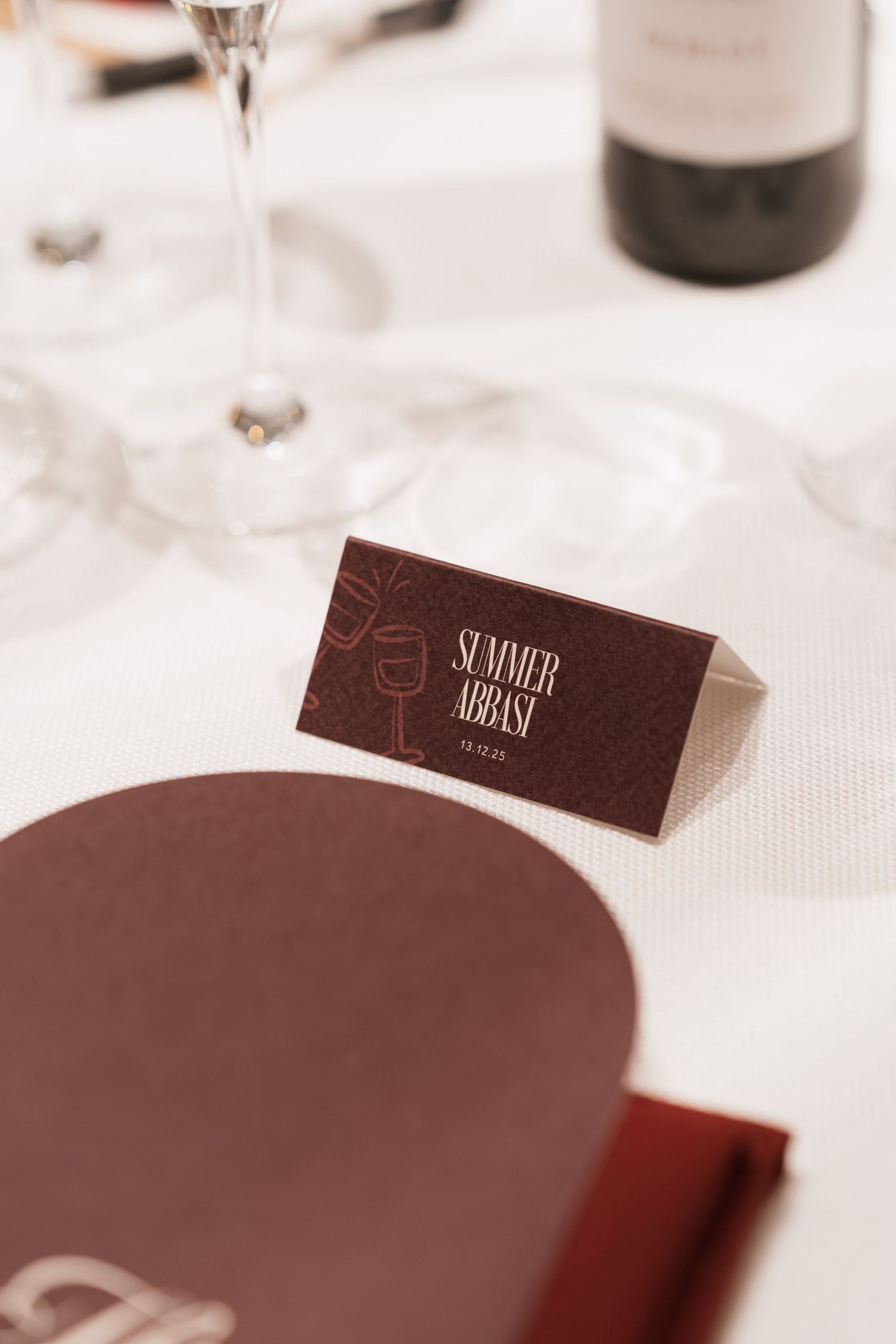Place cards and table settings at an elegant dinner event.