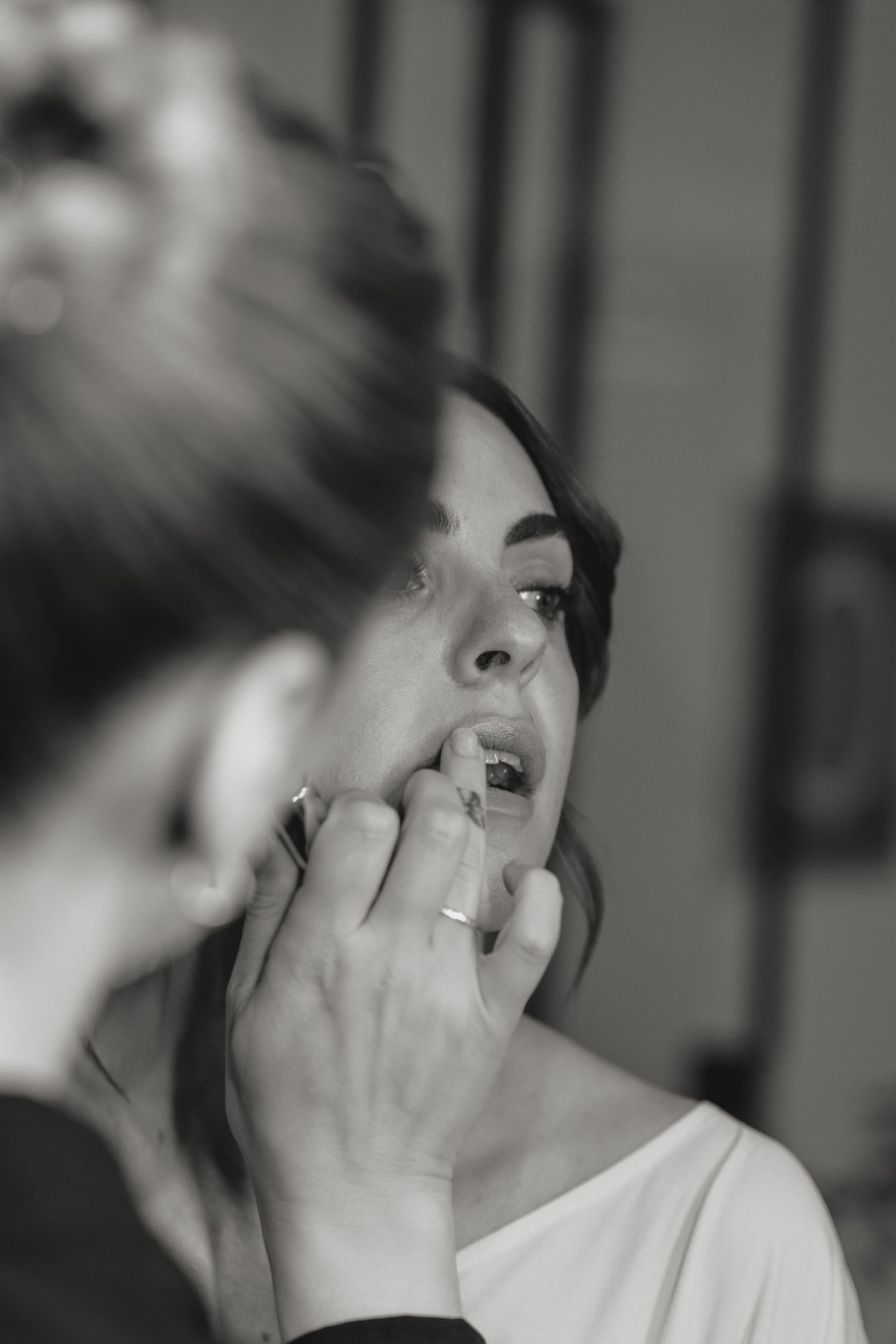 A sequence of intimate black and white candid moments at a celebration.