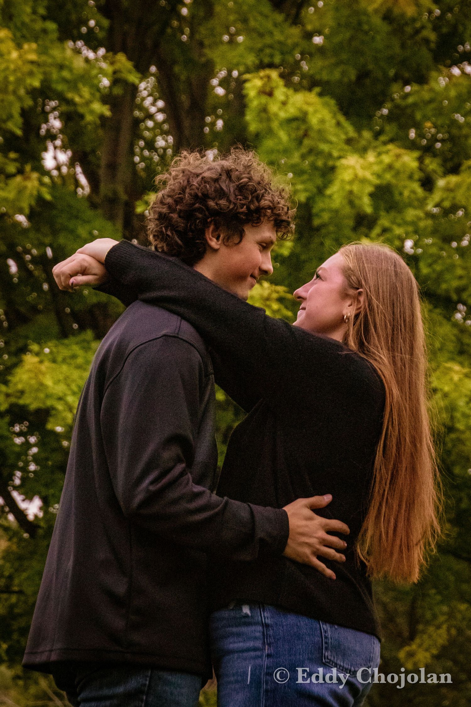 A romantic couple shares intimate moments in a series of outdoor photos against a green background.
