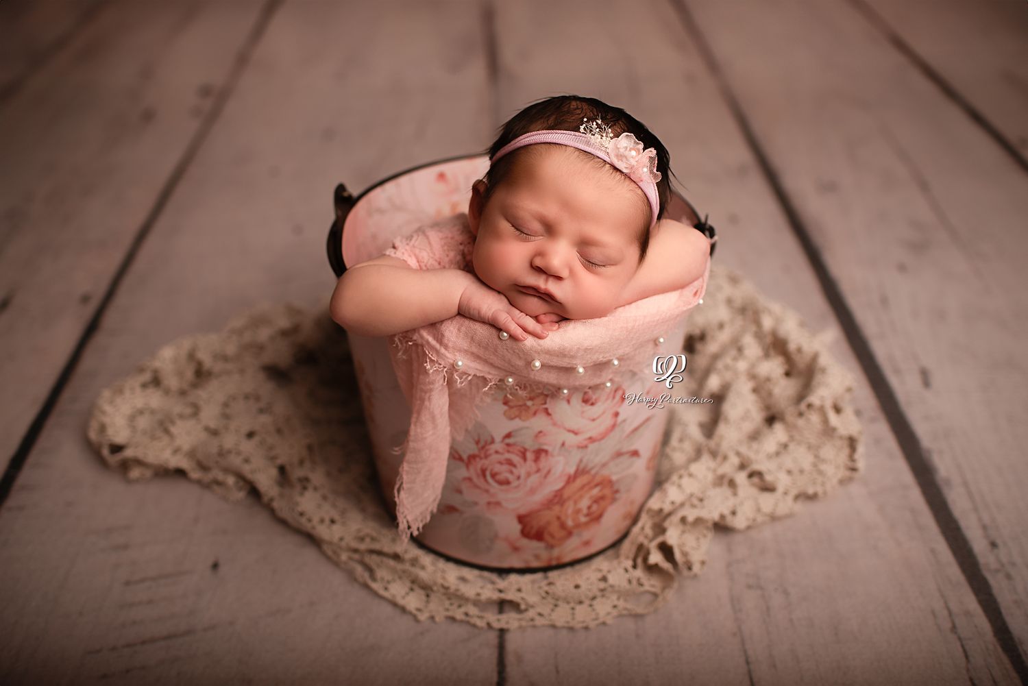 Newborn baby girl posed in bucket with pink & flowers, Lexington, SC newborn photographer; indoor photo studio Lexington