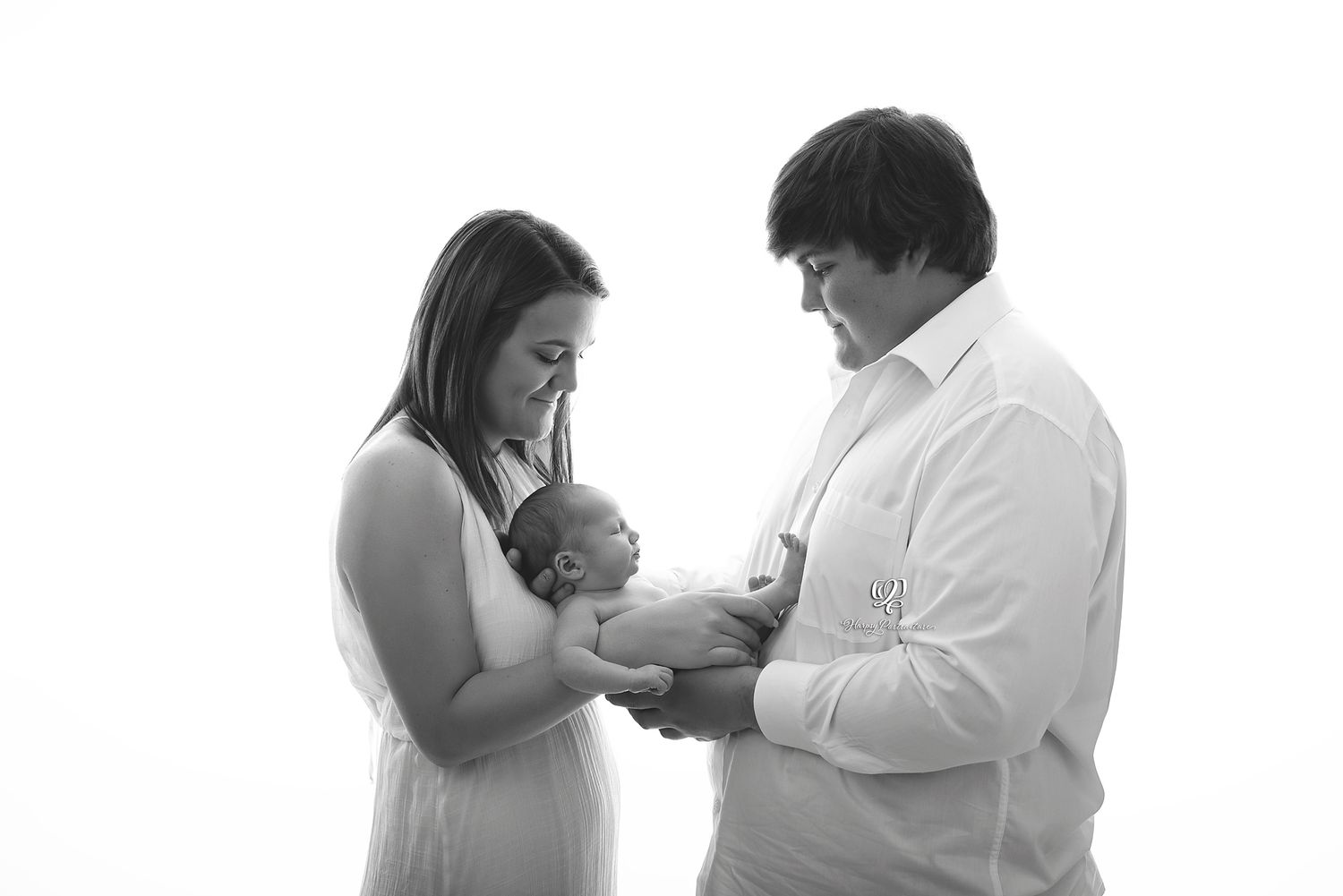 newborn family photo with mom, dad, newborn baby boy in black & white, backlit portrait newborn family; best Lexington, 