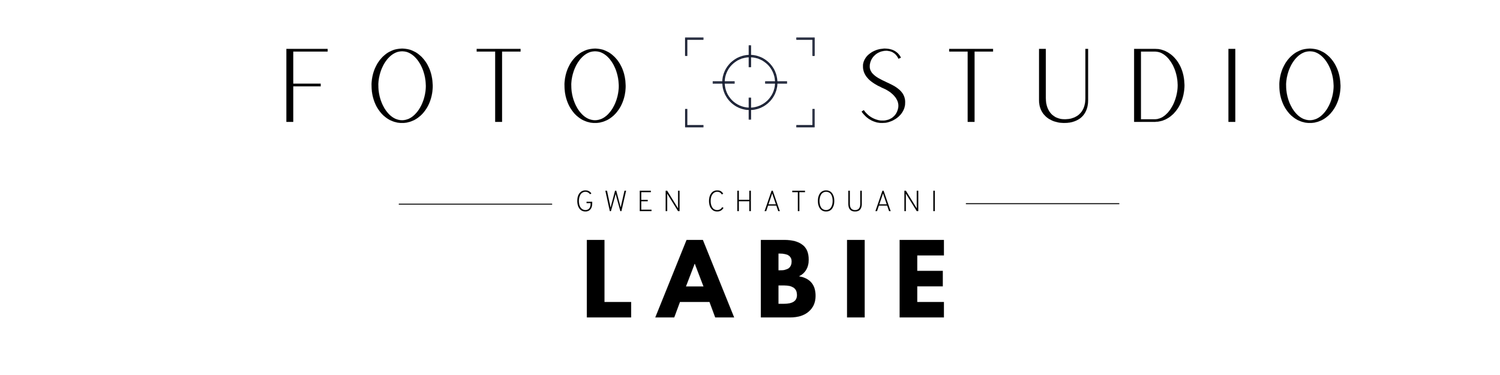 A minimalist black and white logo design for Foto Studio Labie with a camera lens symbol in the text.