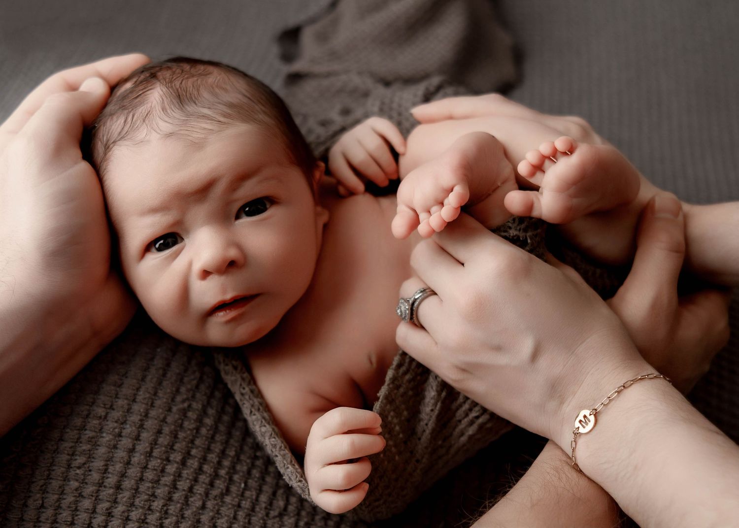 Intimate black and white portrait series of newborn baby moments.