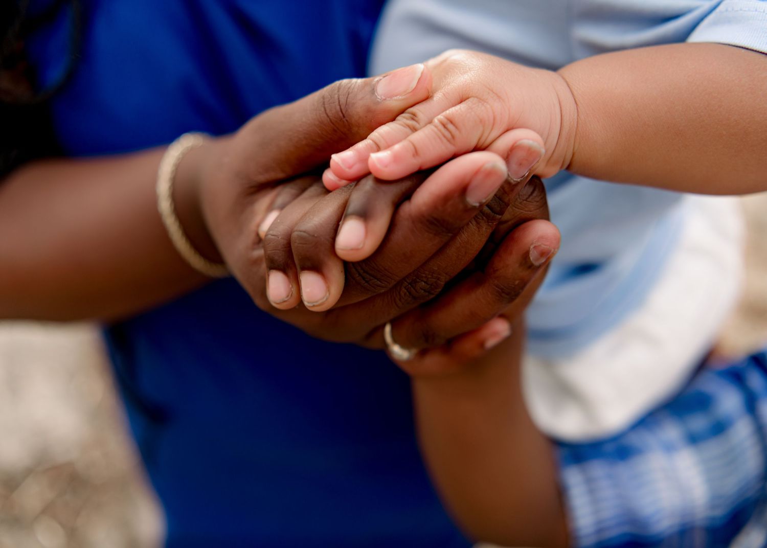 Close-up shots of hands holding each other in sequence showing connection and intimacy.