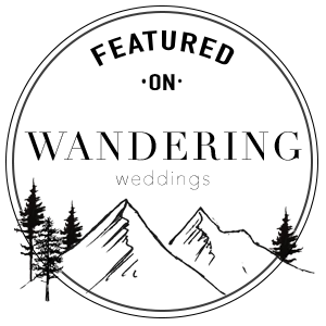 Minimalist circular logo design featuring mountain peaks and pine trees in black line art.