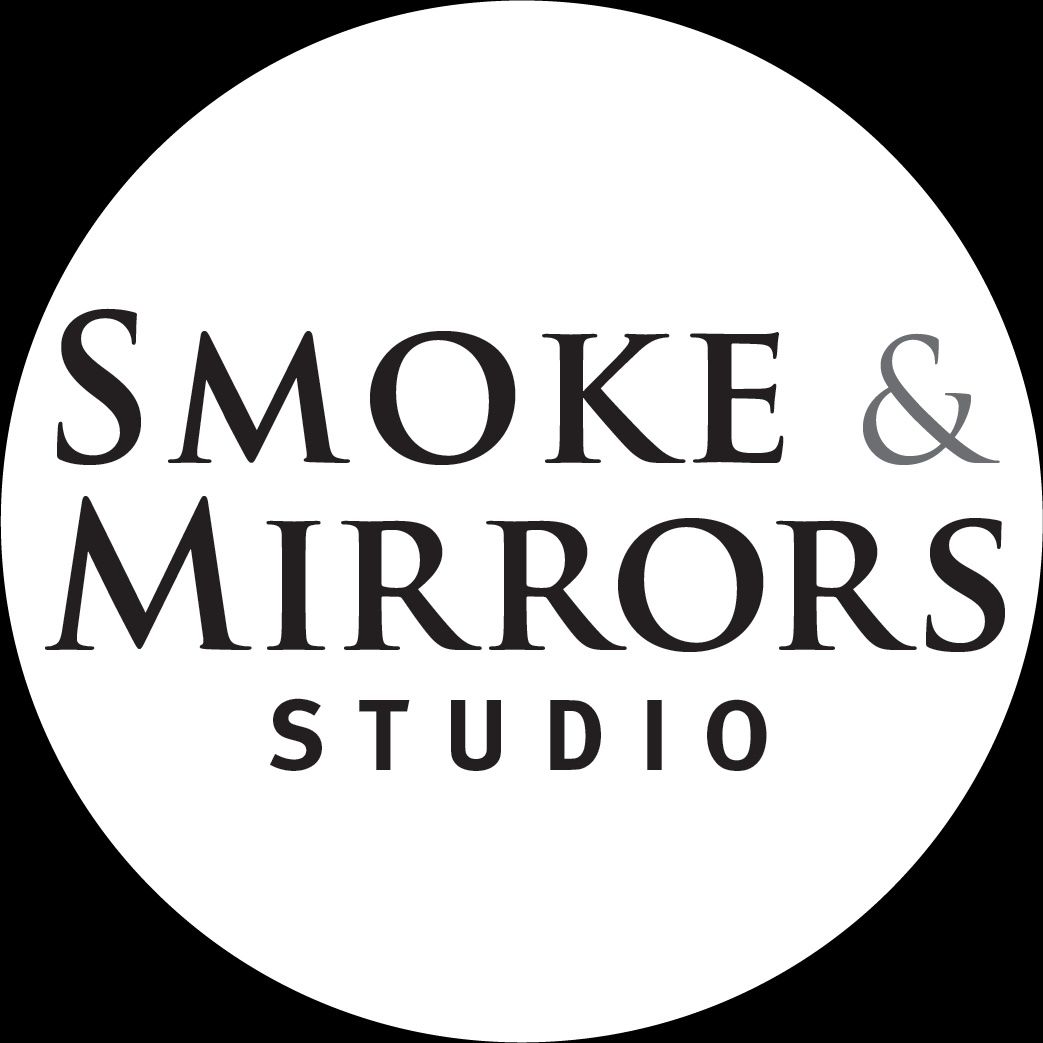 Black and white circular logo for Smoke & Mirrors Studio with elegant serif typography.