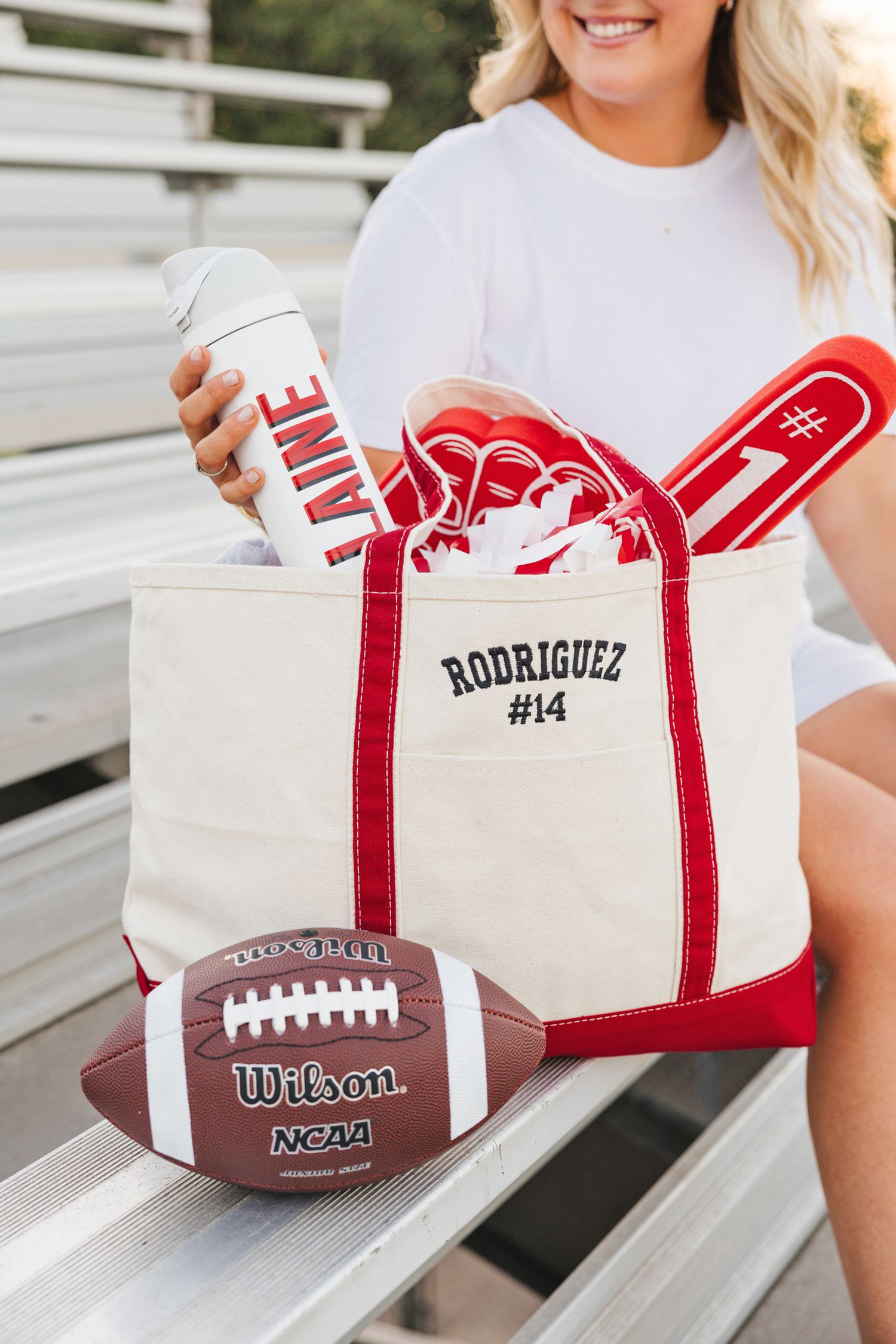 Personalized Rodriguez #14 canvas tote bag with football game day accessories and Wilson NCAA football.