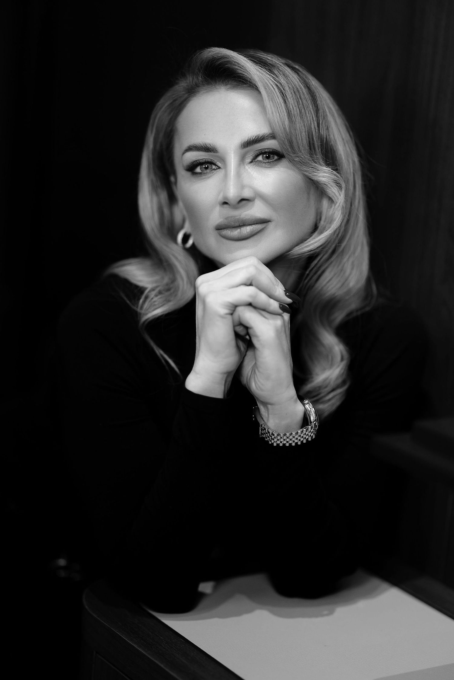 Classic black and white portrait with elegant styling and soft lighting.