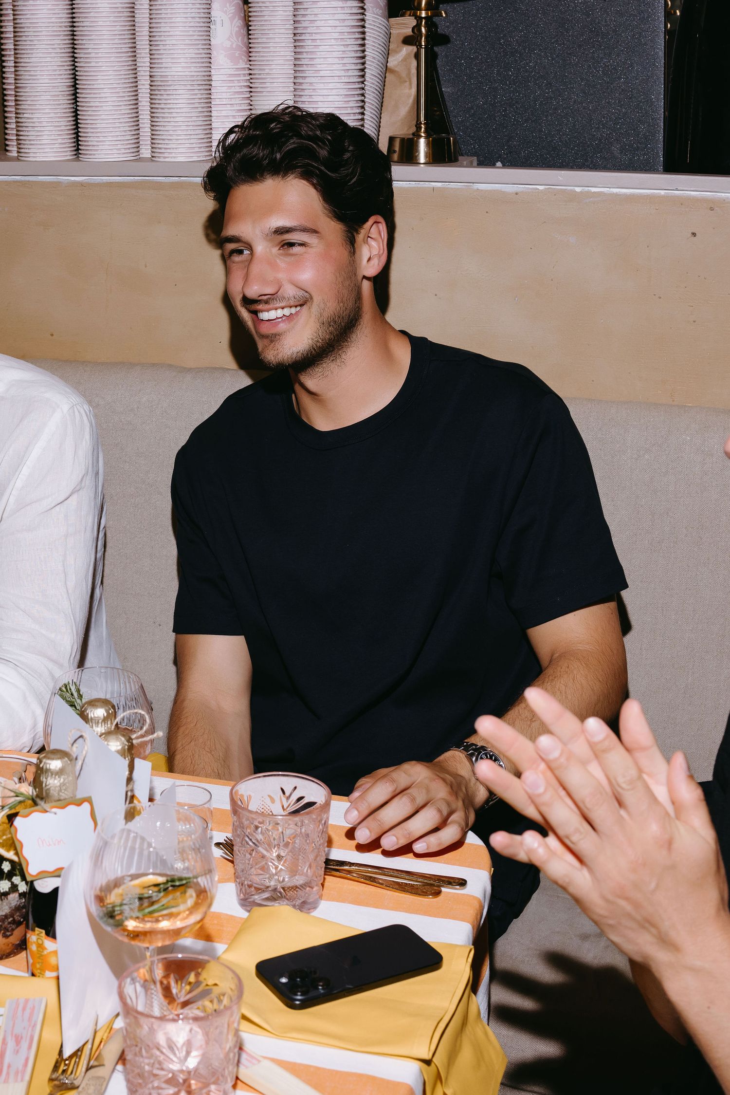 Casual dining scene at restaurant with drinks and place settings.