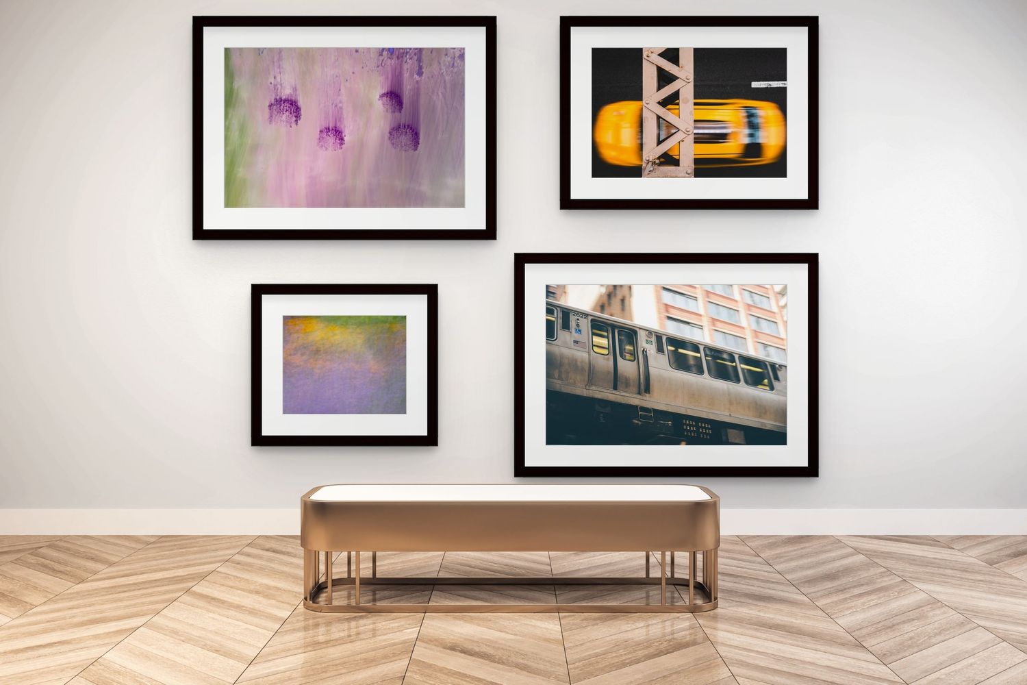 Gallery wall featuring four framed abstract and urban photography prints above a console table.