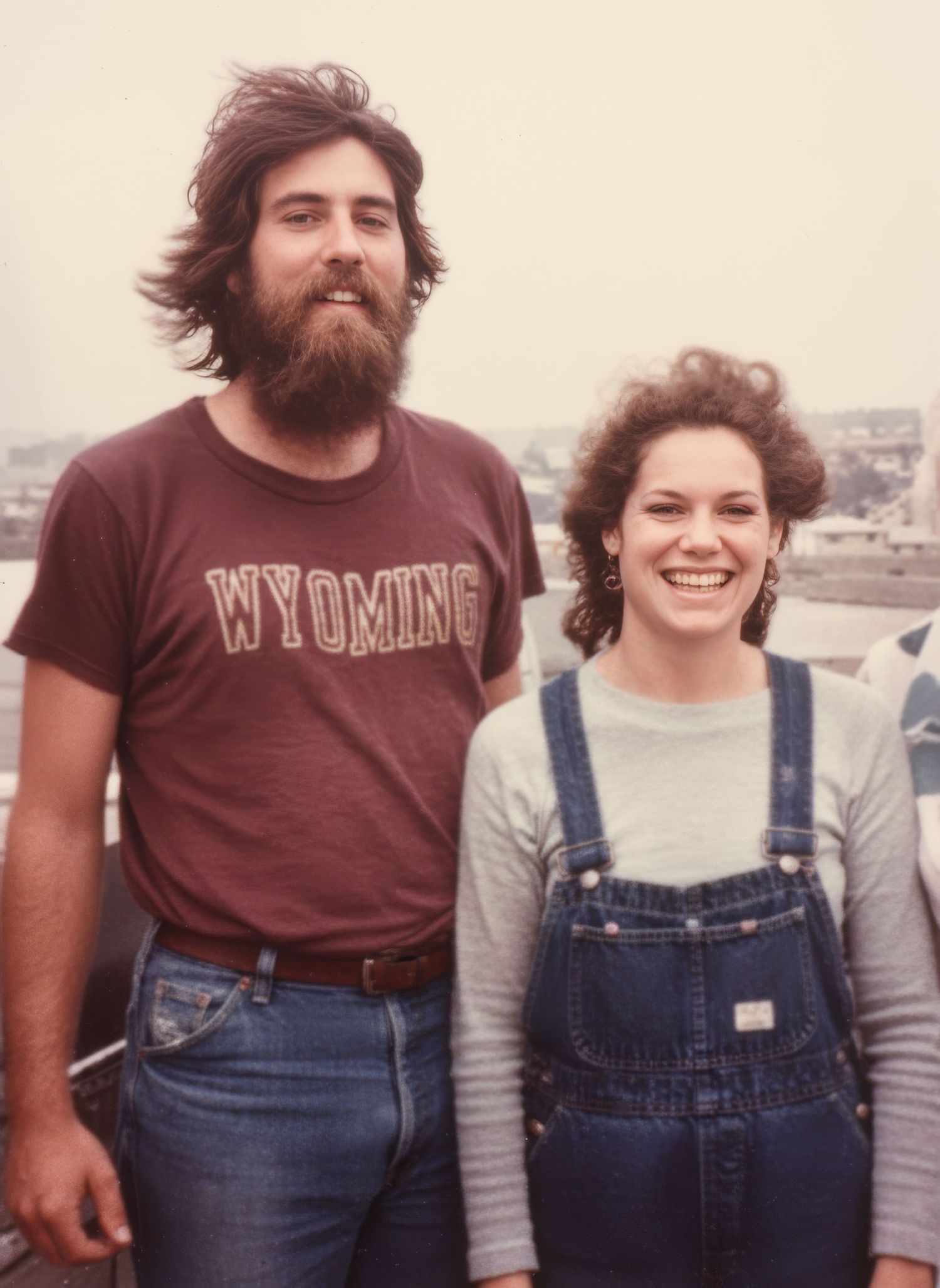 Restored 1970s photograph of a couple after color and detail repair.