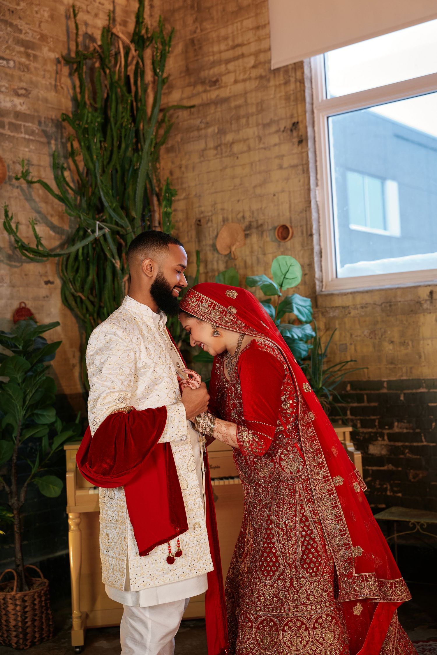 Bride and groom in traditional attire during their wedding film session in Winnipeg