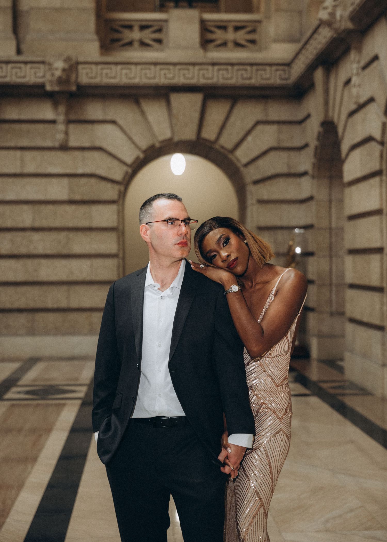 Couple embracing inside the Manitoba Legislative Building during their Winnipeg elopement