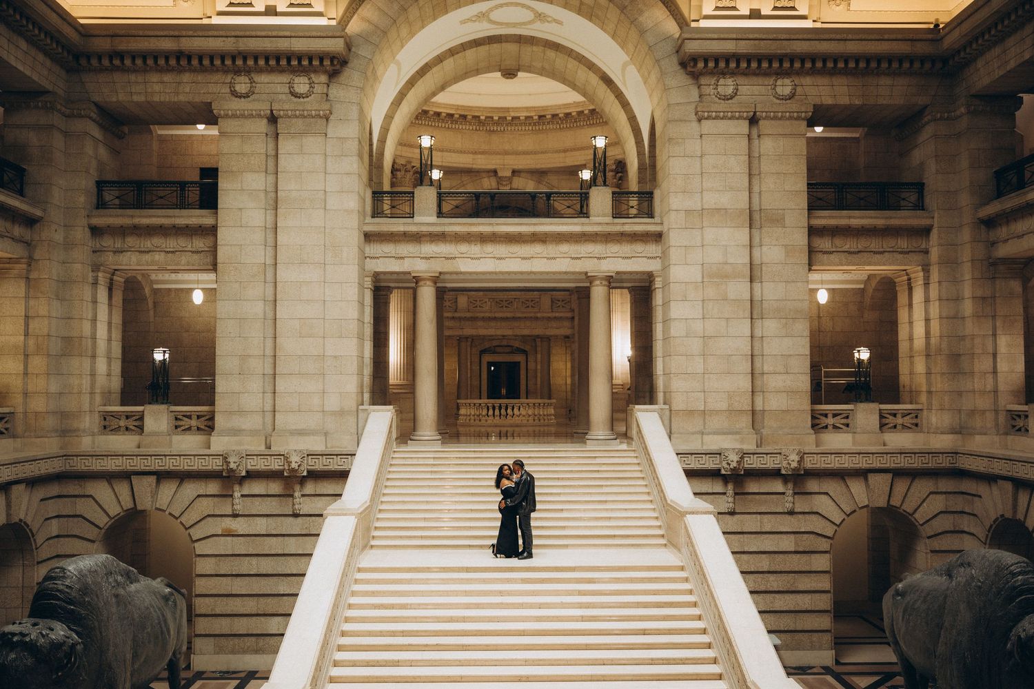 Bride and groom on the marble staircase at the Manitoba Legislative Building Winnipeg