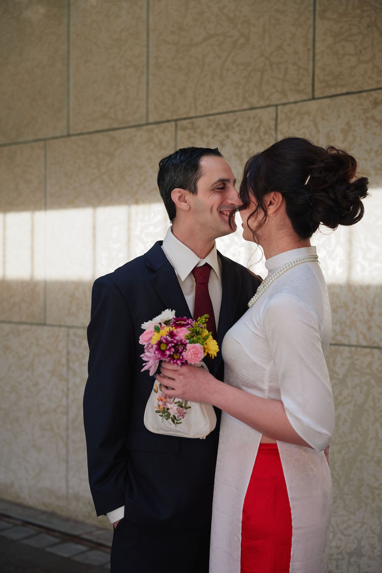 Engaged couple laughing together during their engagement session in Winnipeg