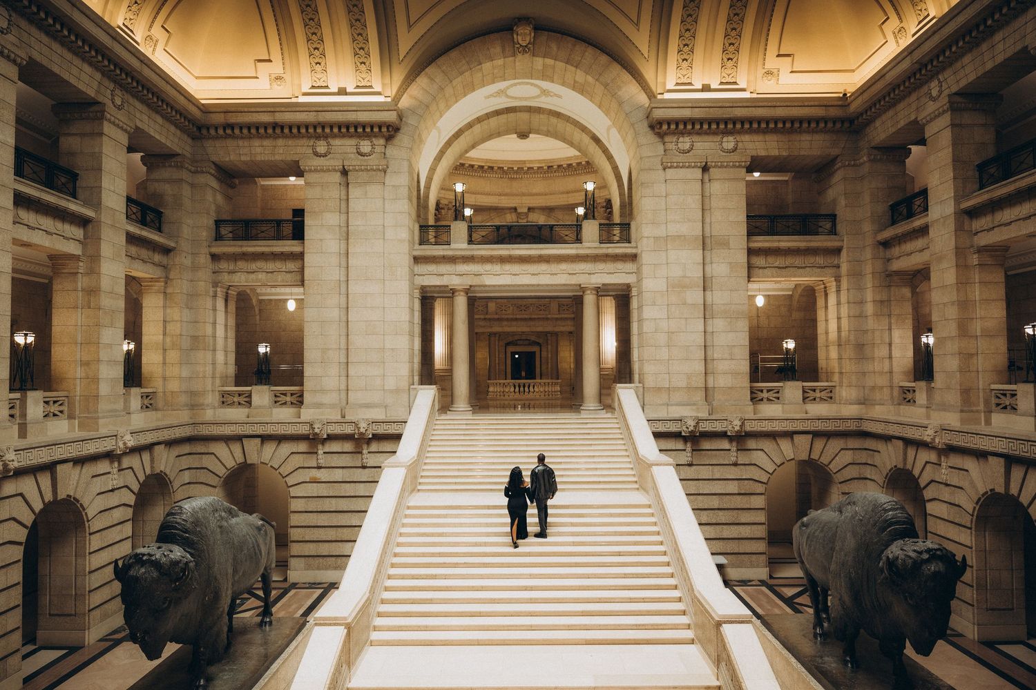 Wedding couple on the grand staircase at the Manitoba Legislative Building in Winnipeg