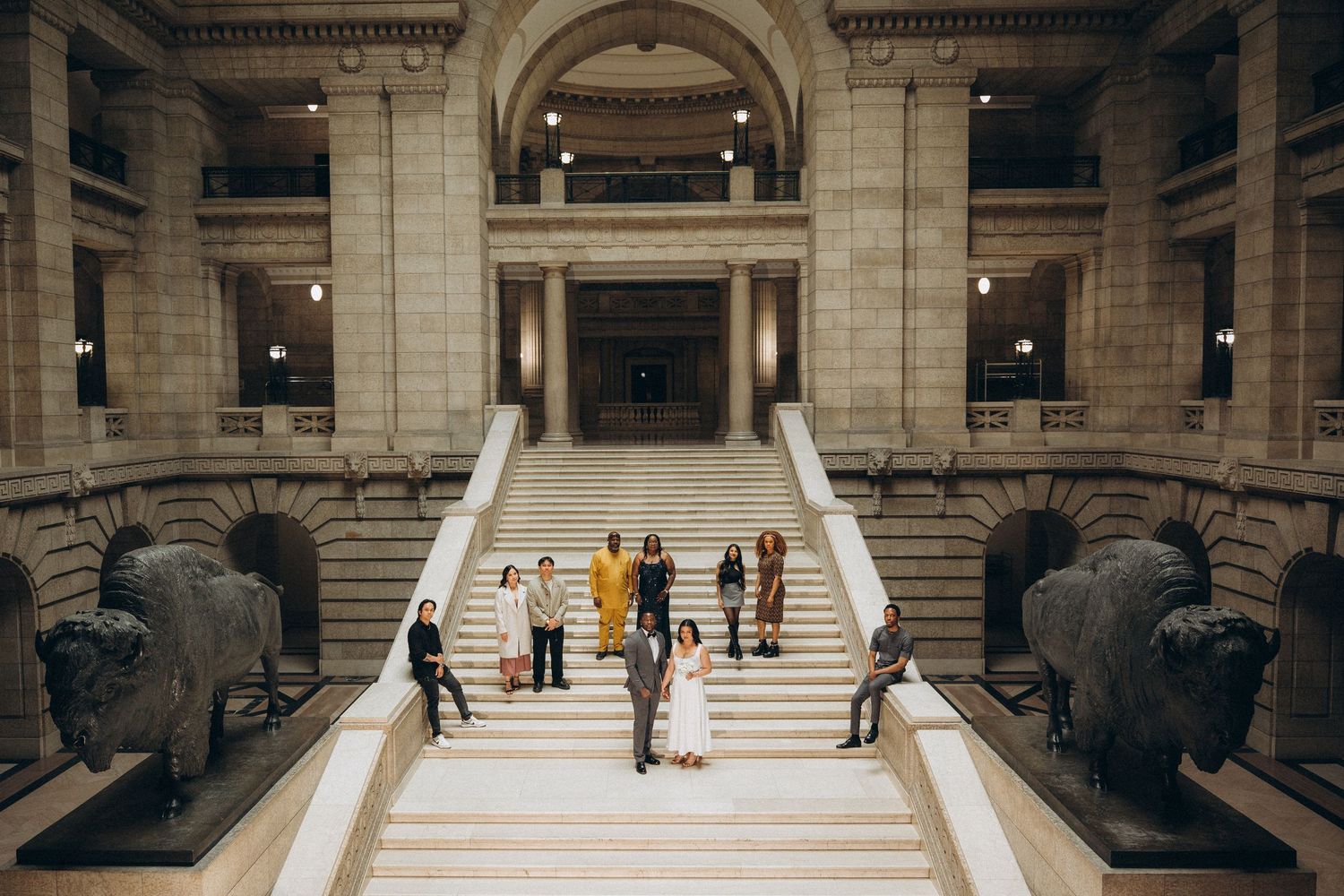 Wedding party portrait on the staircase of the Manitoba Legislative Building Winnipeg