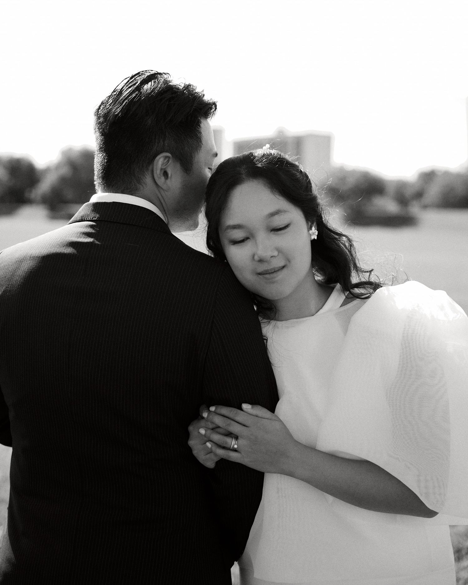 Black and white portrait of bride and groom embracing, Winnipeg wedding