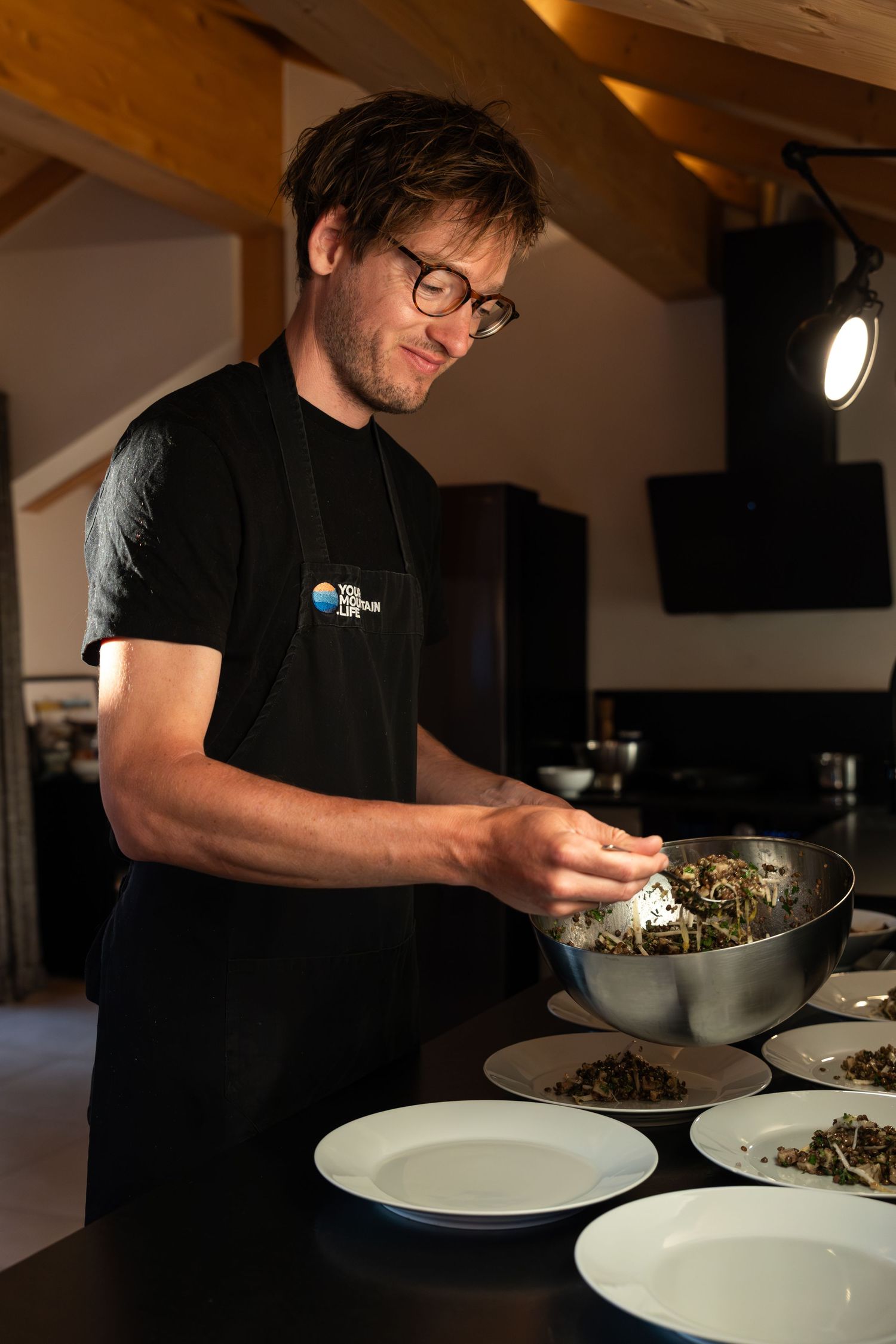 ski chalet chef preparing evening meal for guests