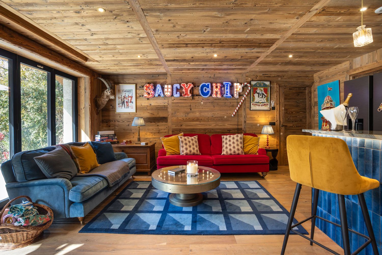 fun and colourful bar cinema room in ski chalet in French alps