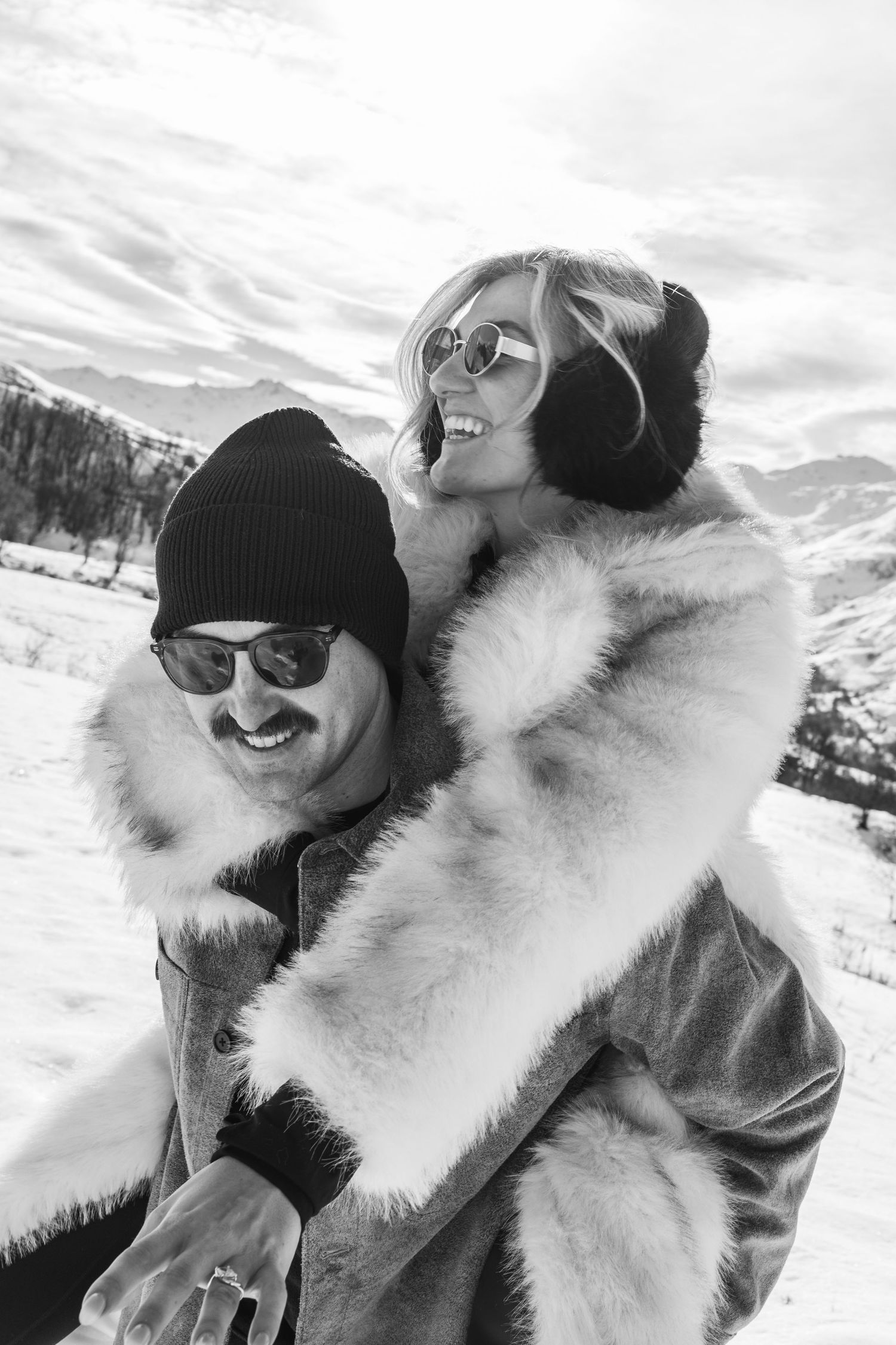 fiancé climbs on partners back for piggy back ride