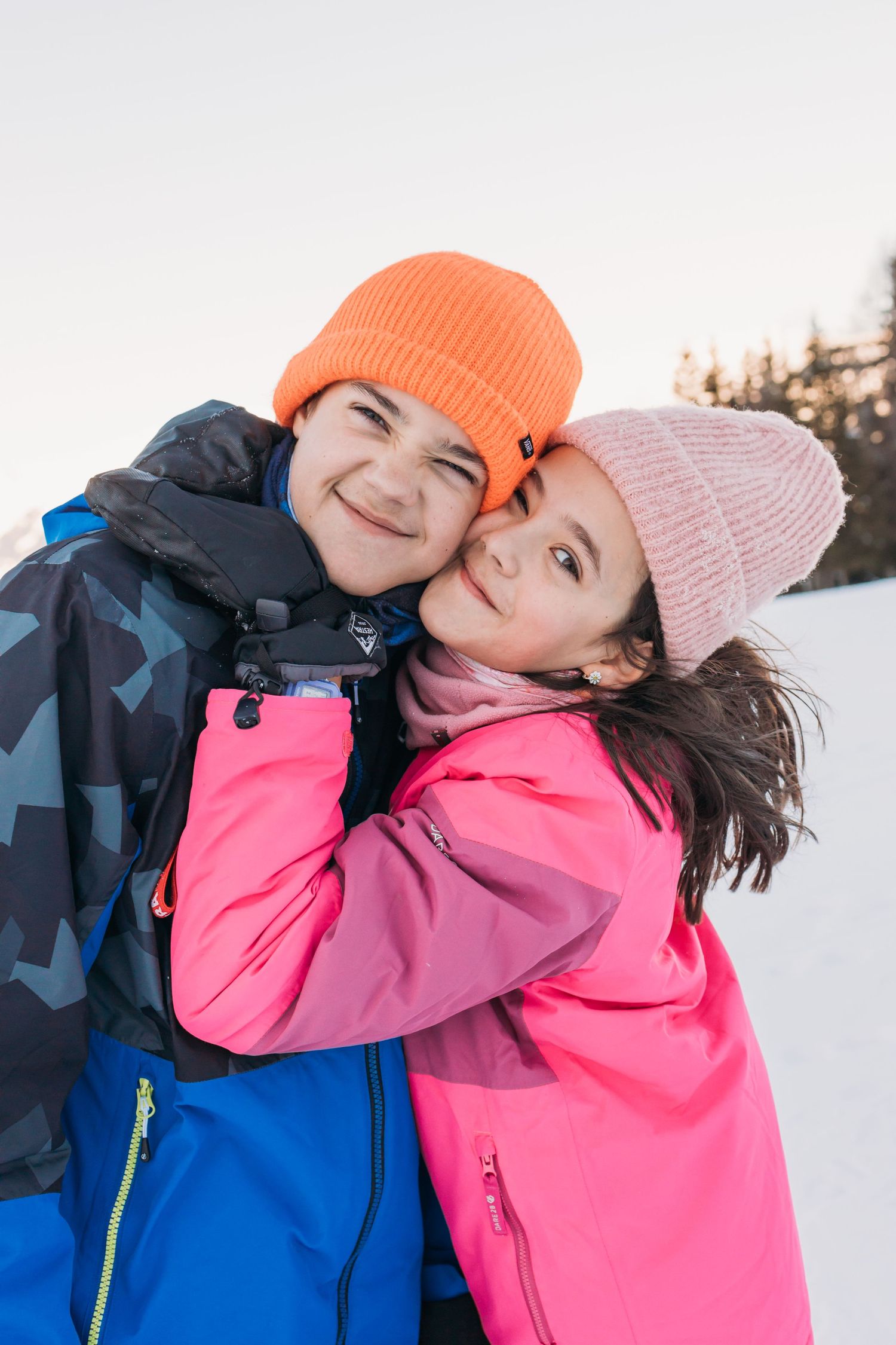 siblings embrace in silly fun way