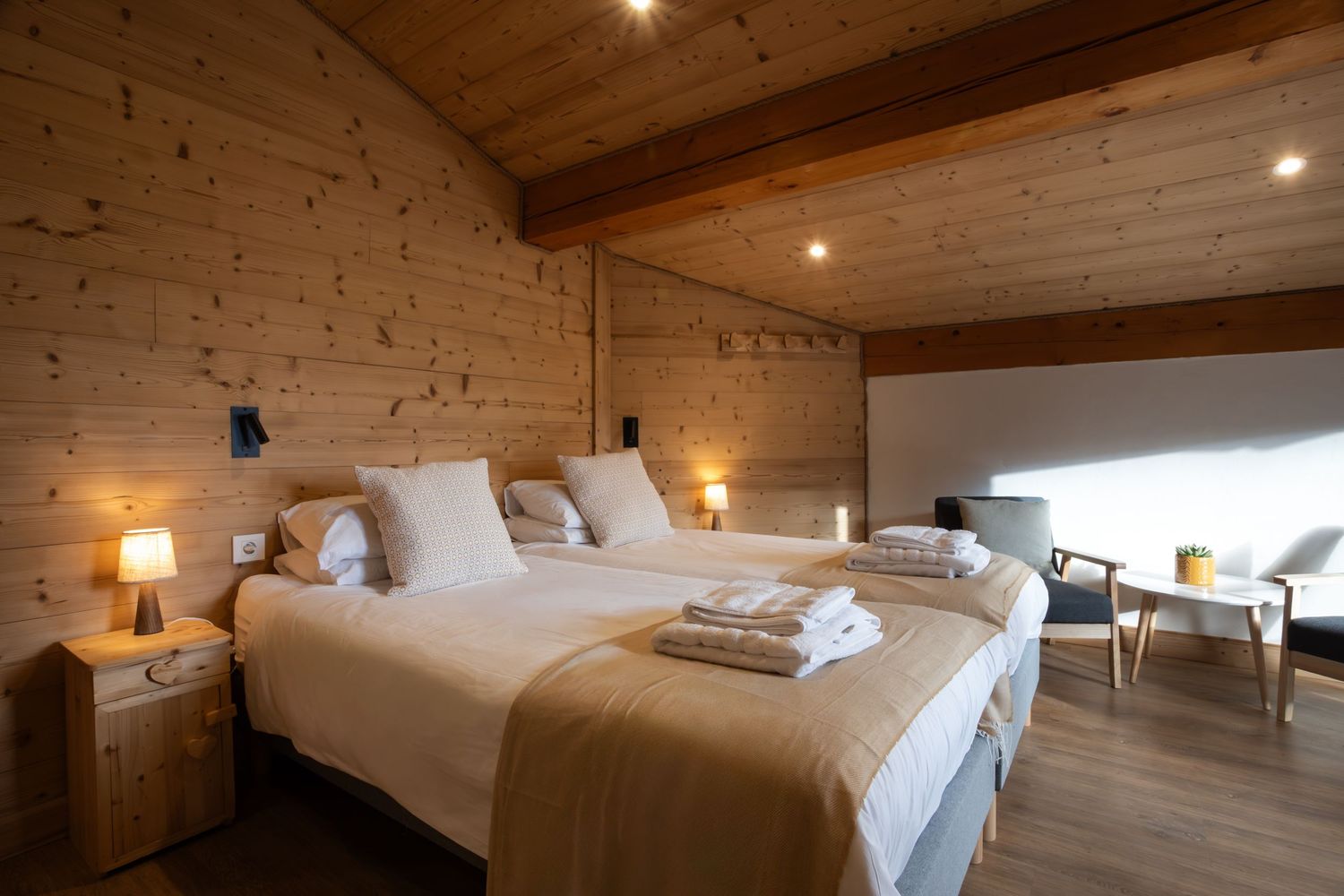 two single beds in bedroom of ski chalet