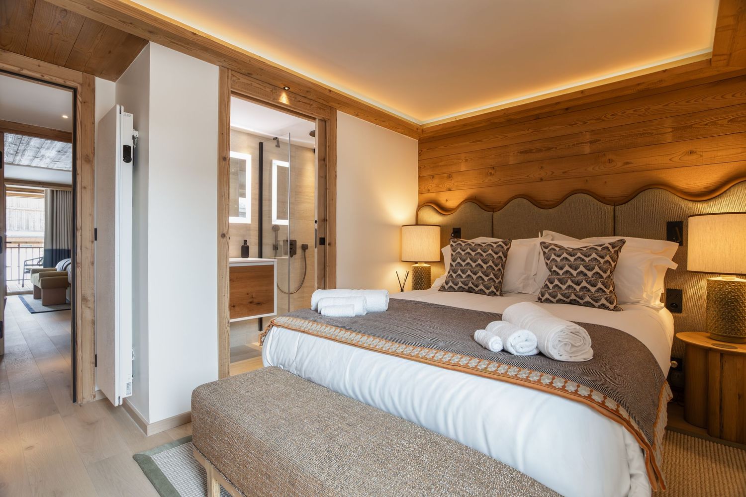 large bed in ski chalet with ensuite