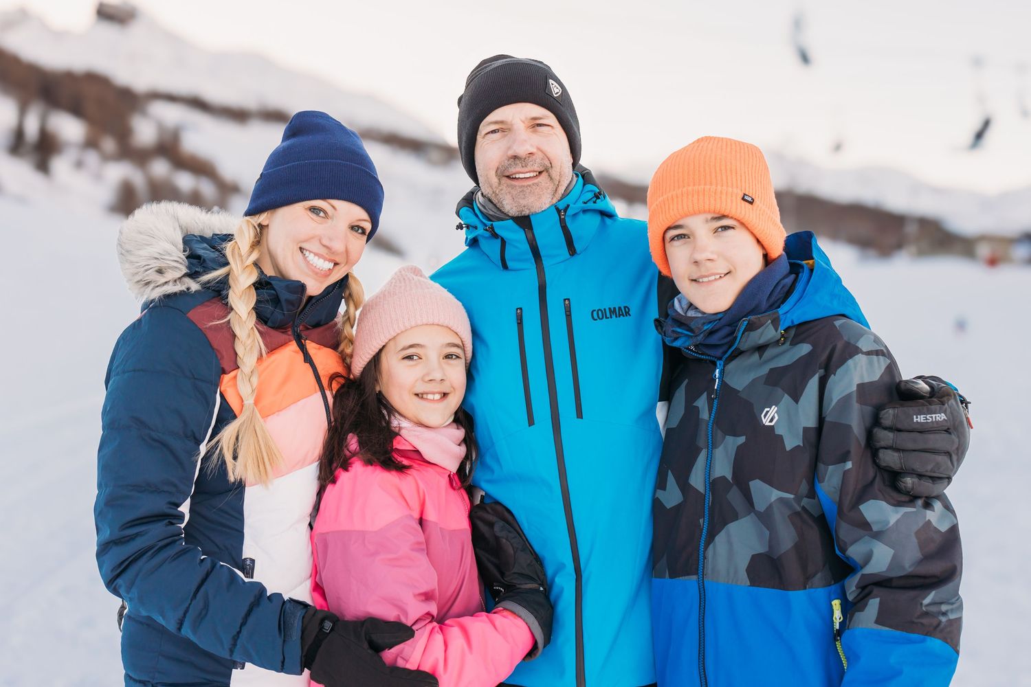 Family of four photo piste side in Les Arcs ski resort