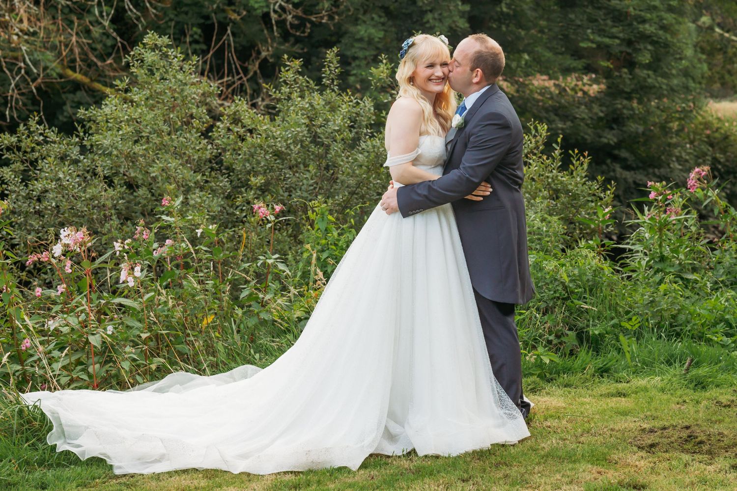 bring and groom embrace in garden