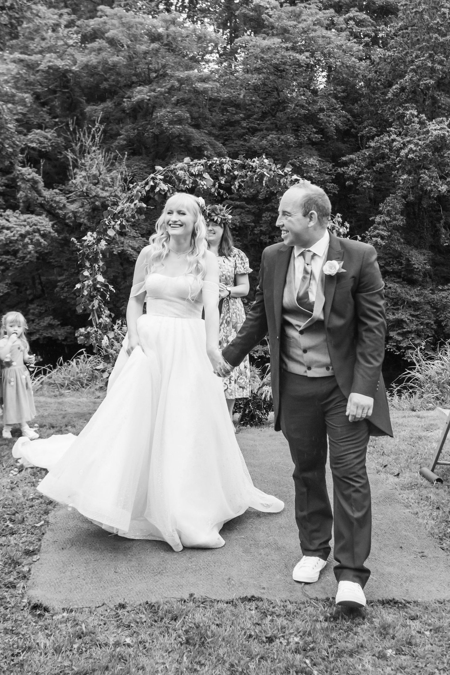bride and groom walk down the aisle after wedding
