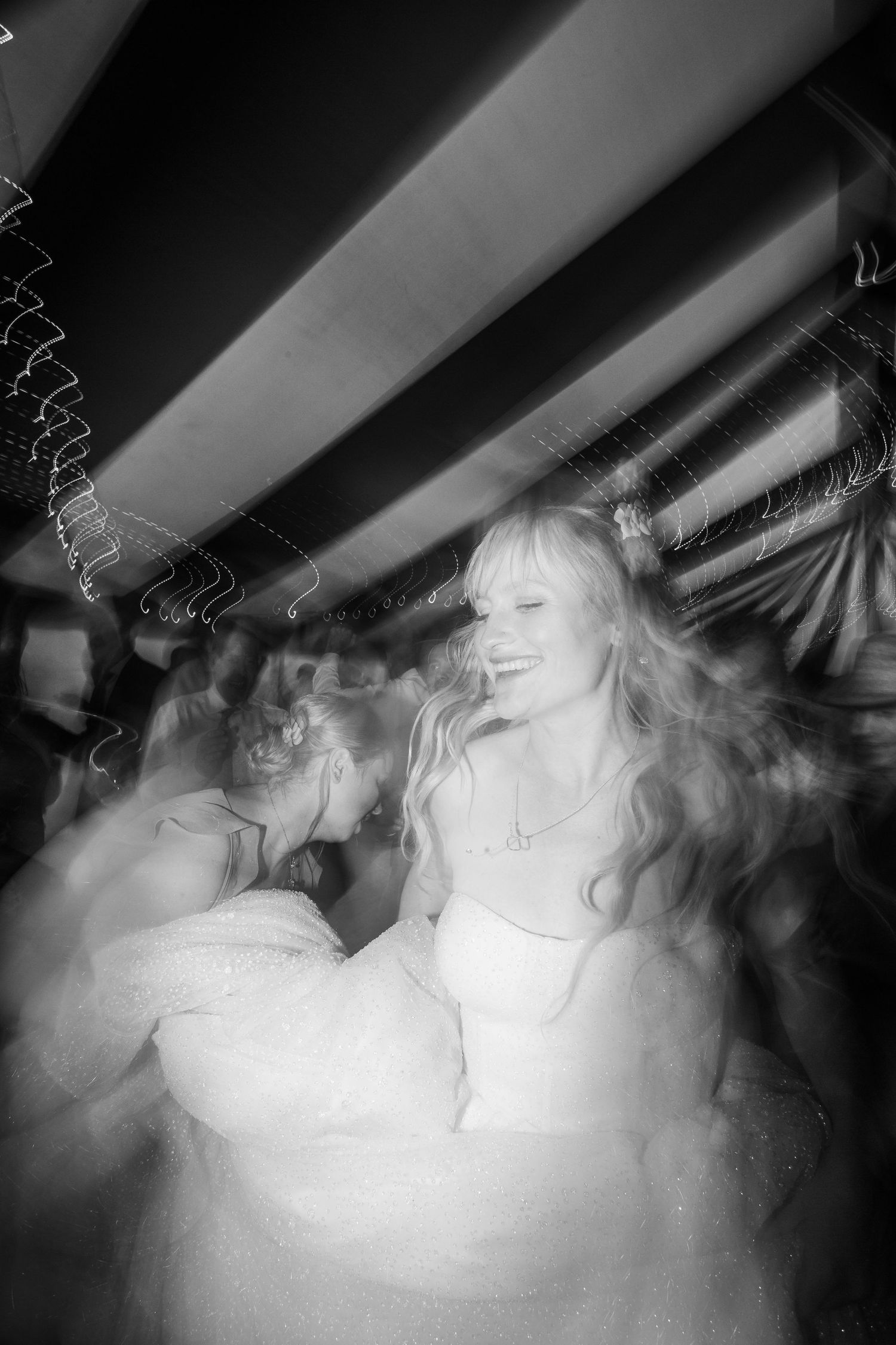 bride dancing at wedding reception and dress moving freely