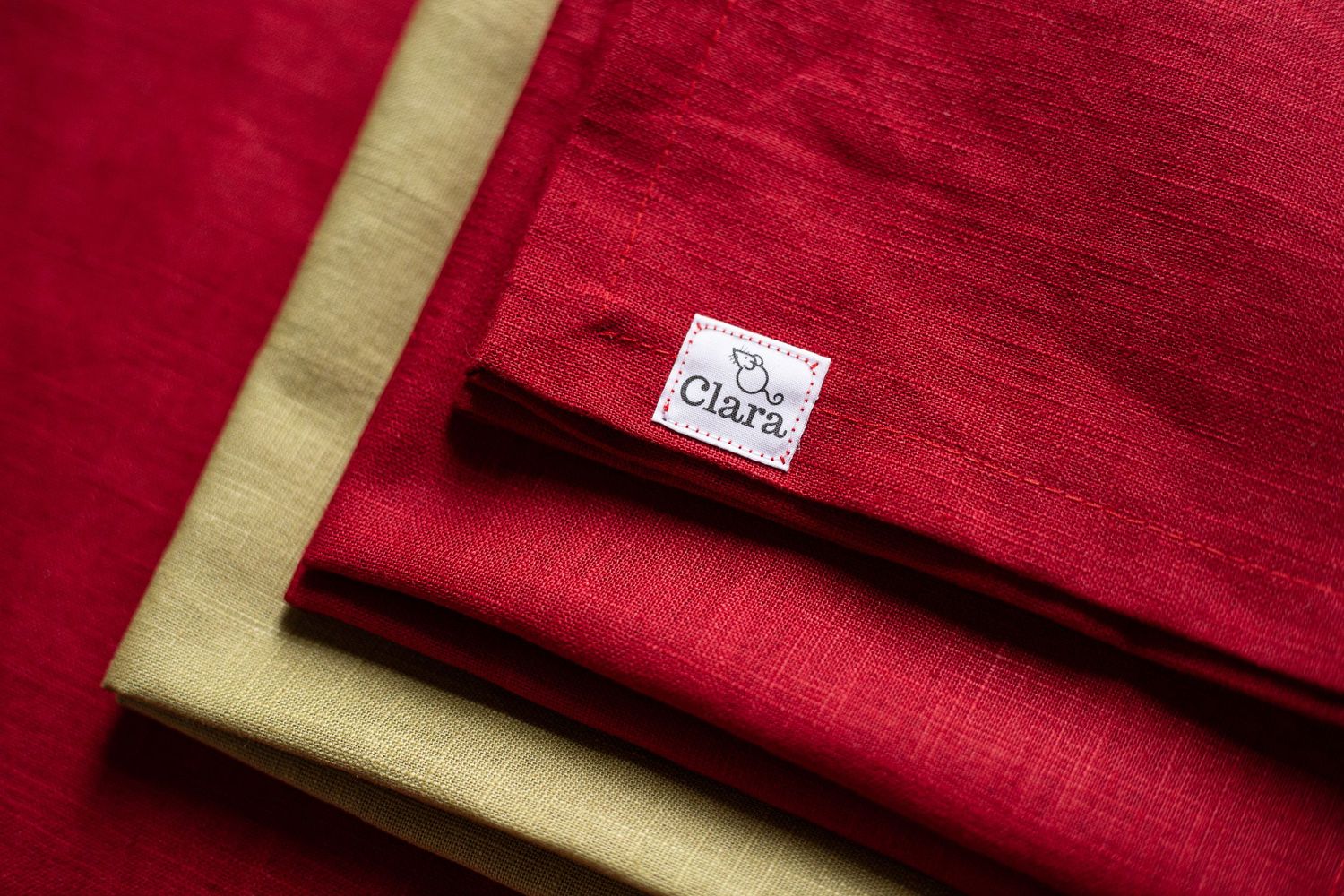 red and green linen napkins laying onto of each other
