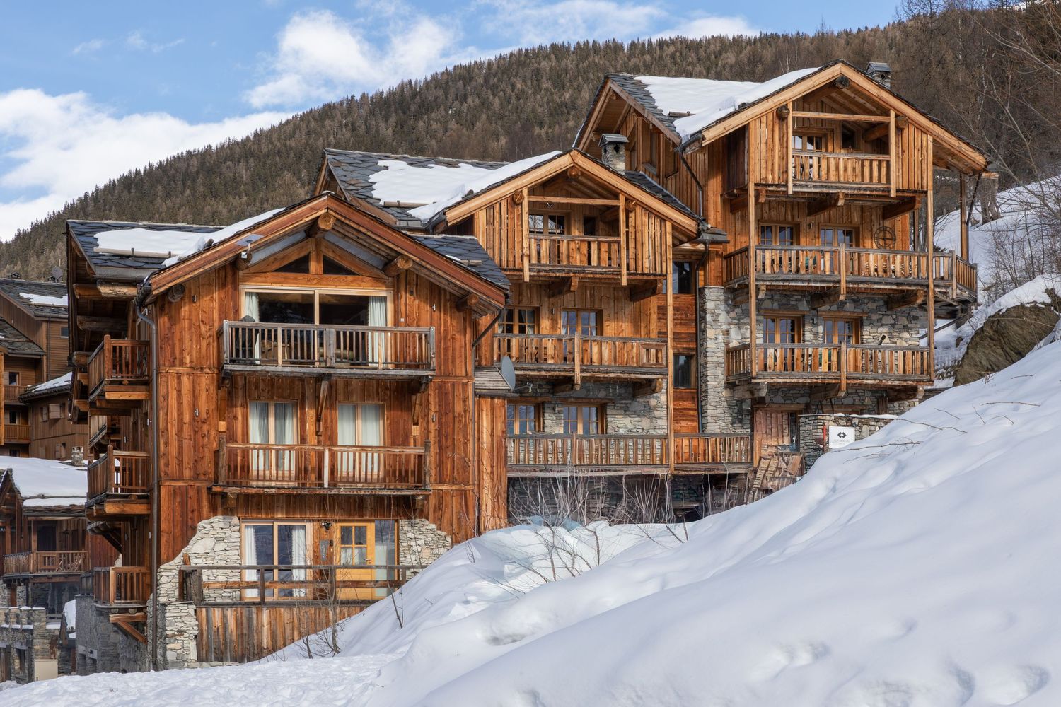 large ski chalet complex exterior surrounded by snow