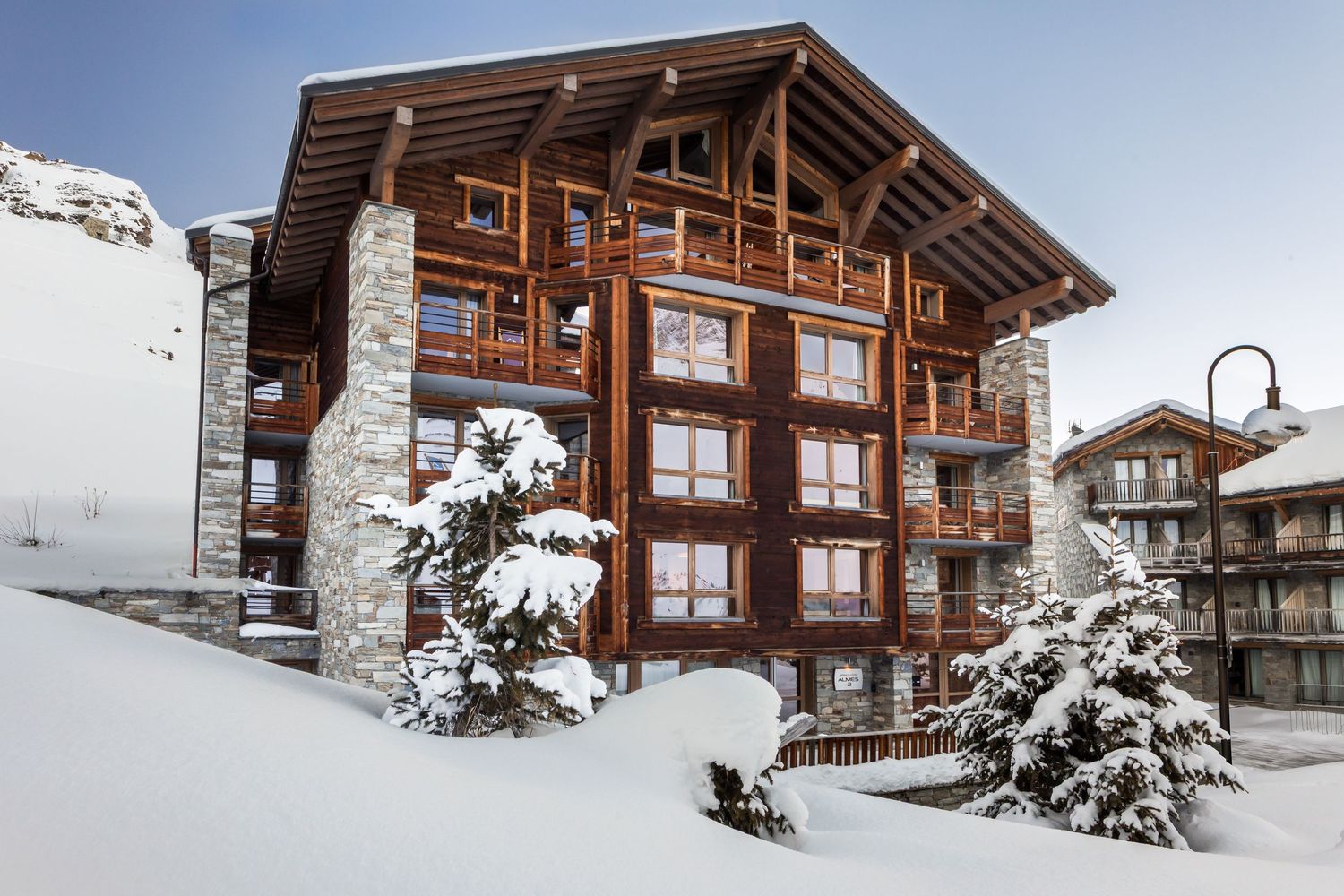 large apartment building in Tignes surrounded by deep snow