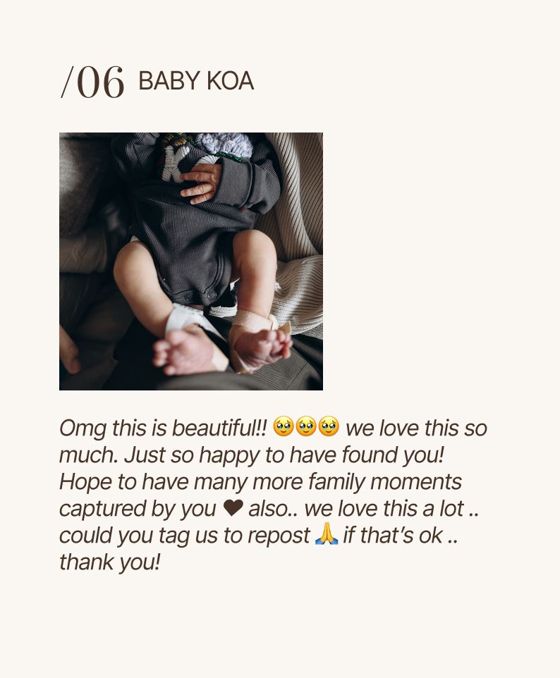 Close-up photo of Baby Koa sleeping peacefully in a car seat, with tiny hands visible against dark clothing.