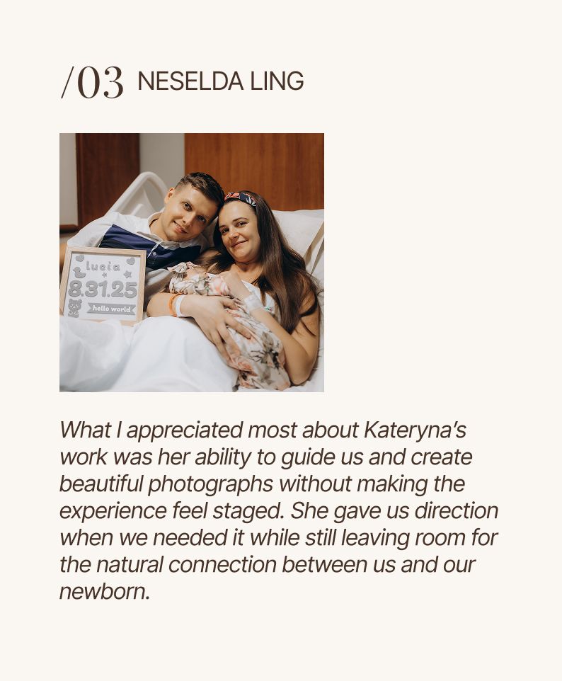 New parents smile with newborn in hospital bed, holding a birth stats sign, in a warm lifestyle photography portrait.