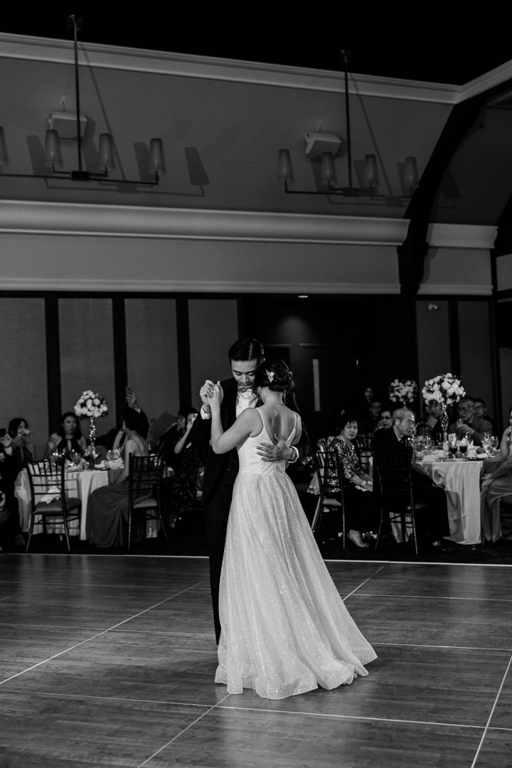 Bride and groom's first dance at a romantic evening wedding reception in Angus Glen Golf Club.
