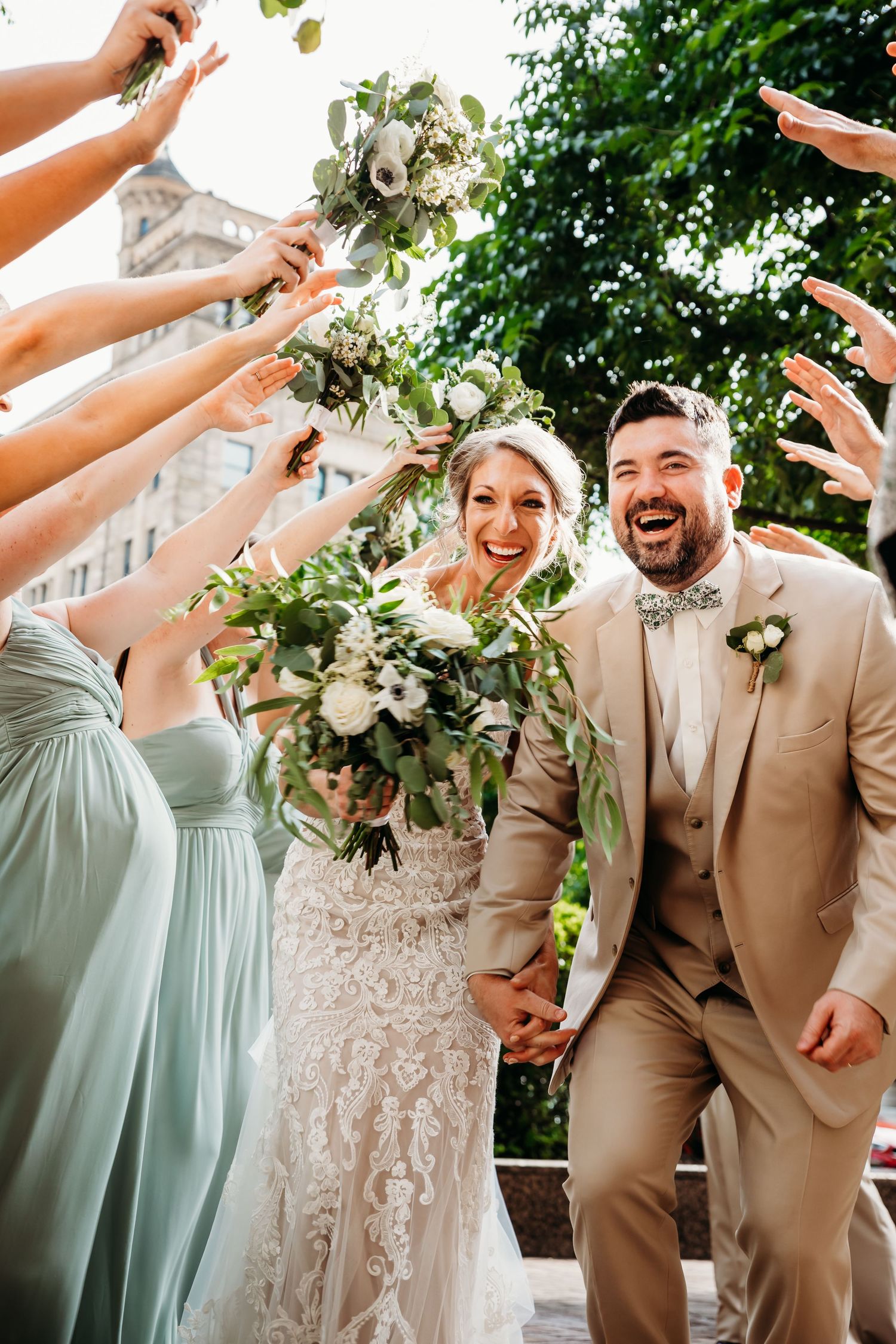 wedding photo couple laughing with friends in louisville ky