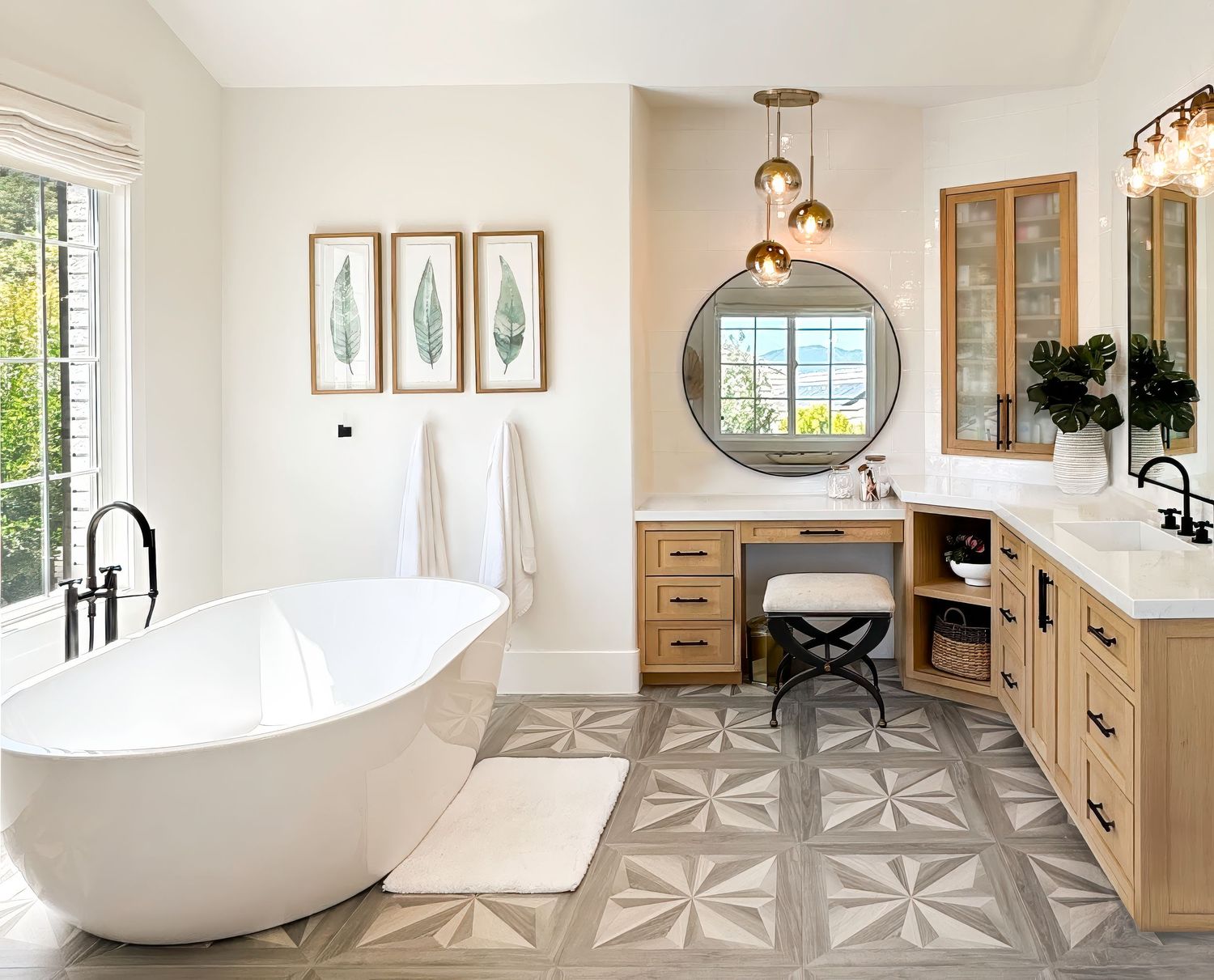 Modern bathroom with freestanding tub, geometric floor tiles, and natural wood accents shot by interior photographer in southern California