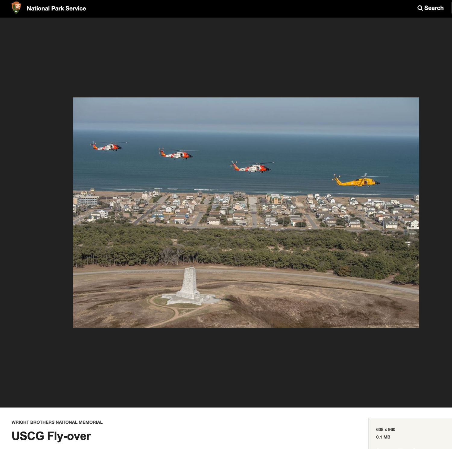 Aerial view of coastline with four helicopters flying in formation over lighthouse.