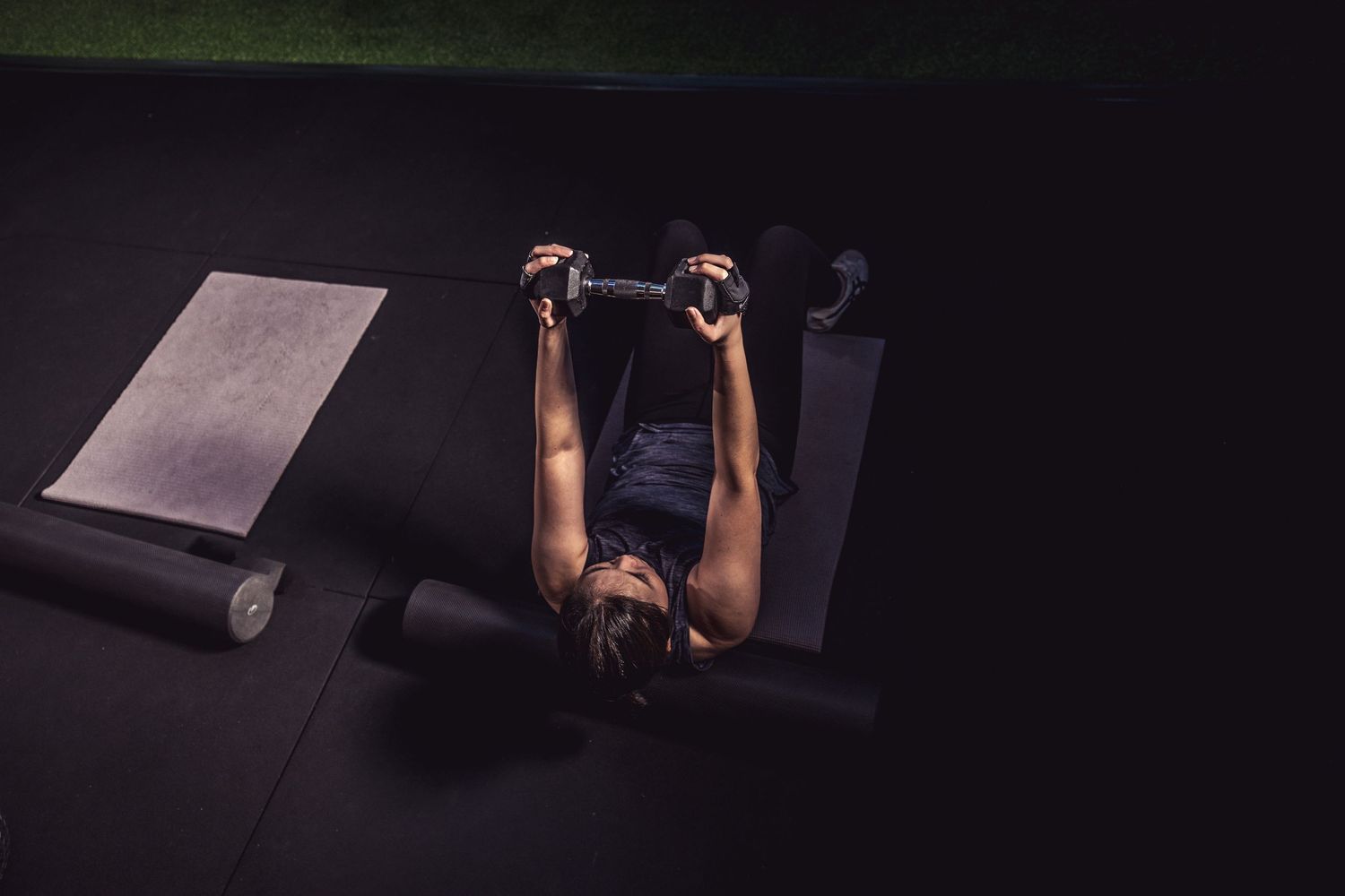 Top-down lighting meets full-body control, this fitness photo highlights strength, form, and focus—perfect for gym brands in Boston